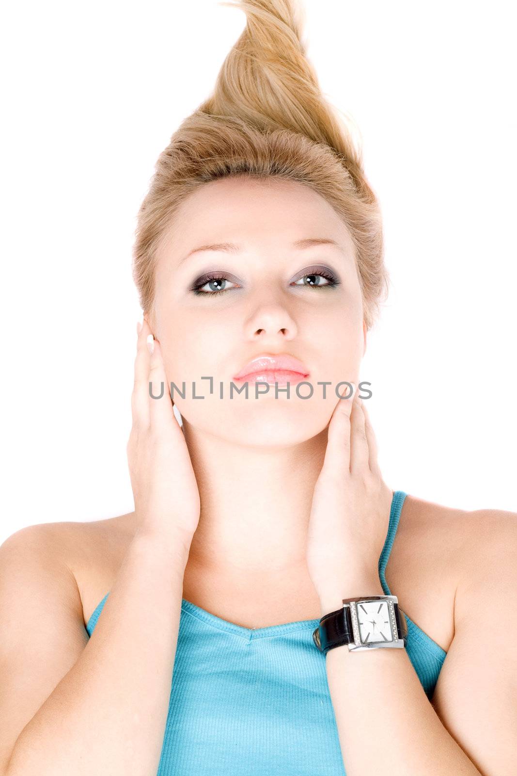 Closeup portrait of pretty blond girl lying on a white