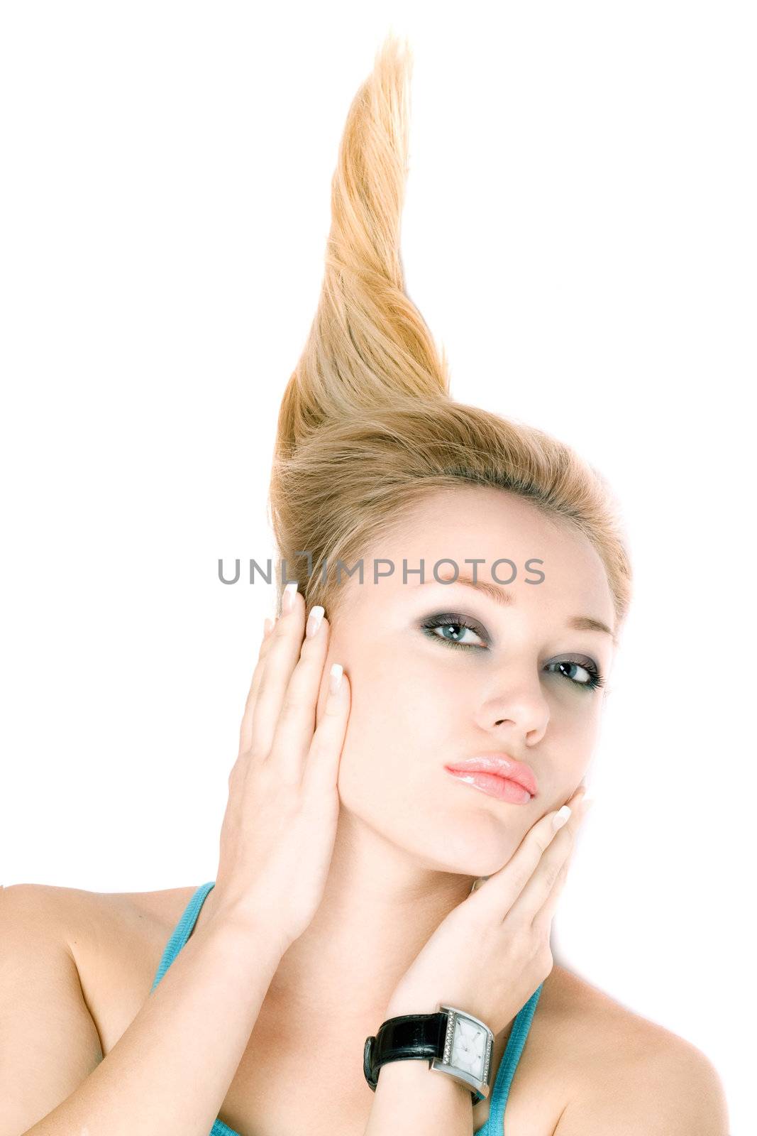Closeup portrait of pretty young blond girl lying on a white