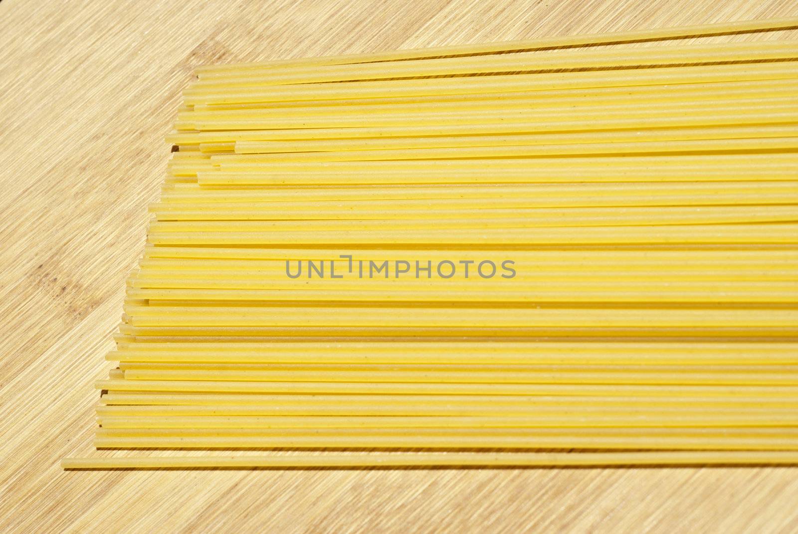 spaghetti pasta on wooden board