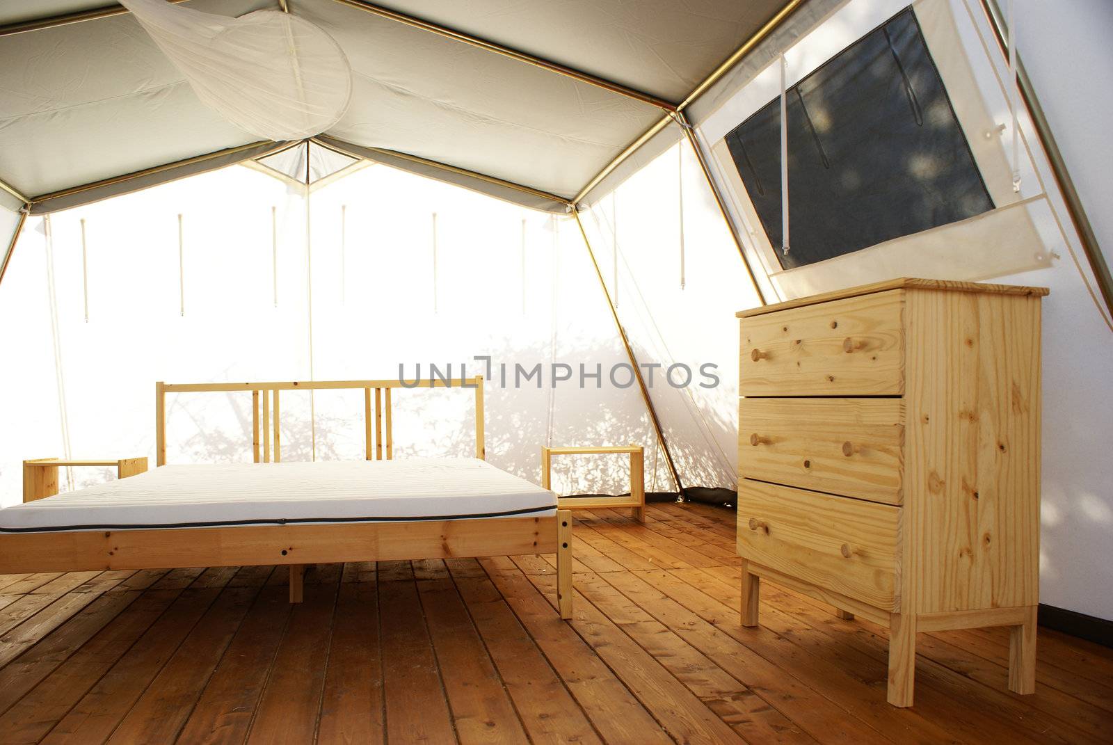 inside a large tent with luxurious furnishings