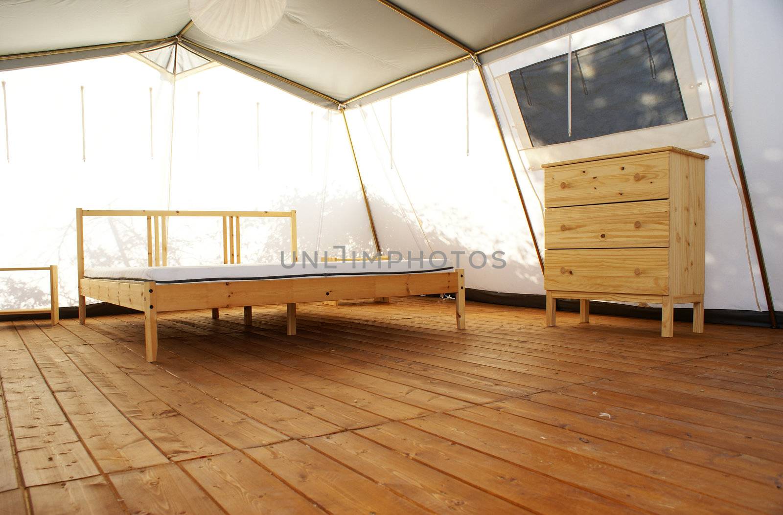 inside a large tent with luxurious furnishings