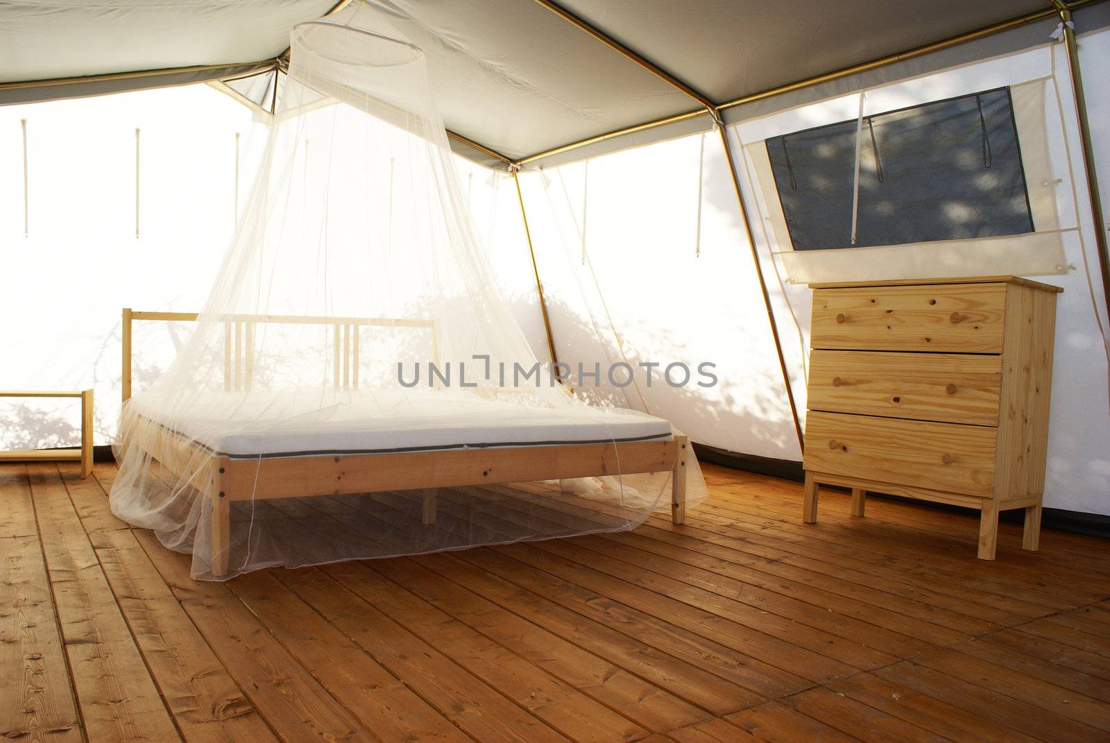inside a large tent with luxurious furnishings