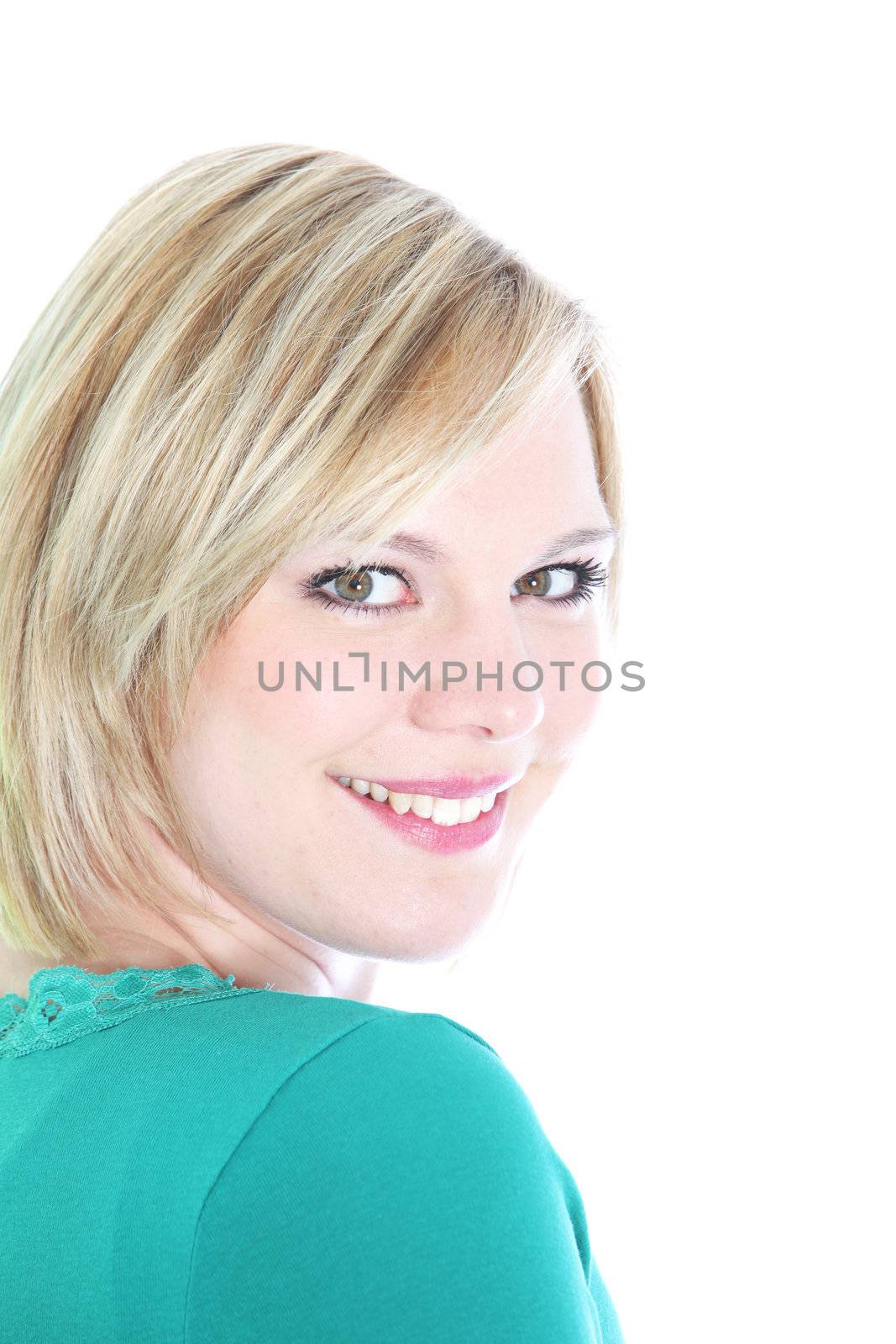 Smiling blonde woman looking over her shoulder isolated on white