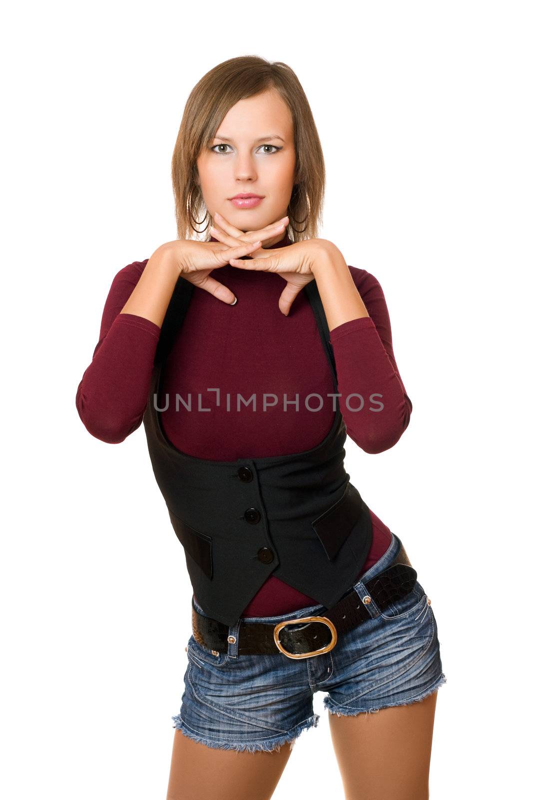 Portrait of young woman in a black vest and denim shorts