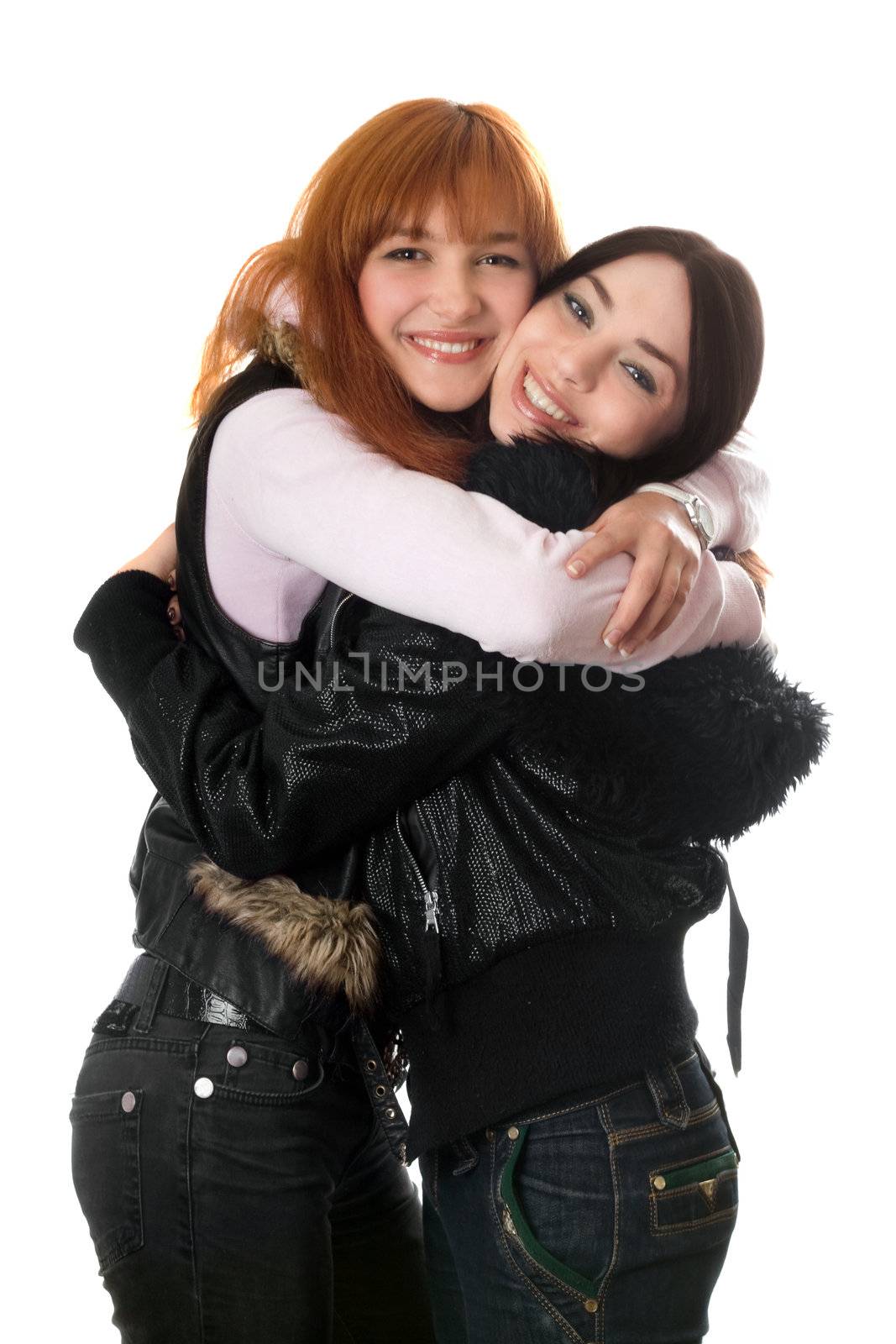 Portrait of two happy young women embracing. Isolated