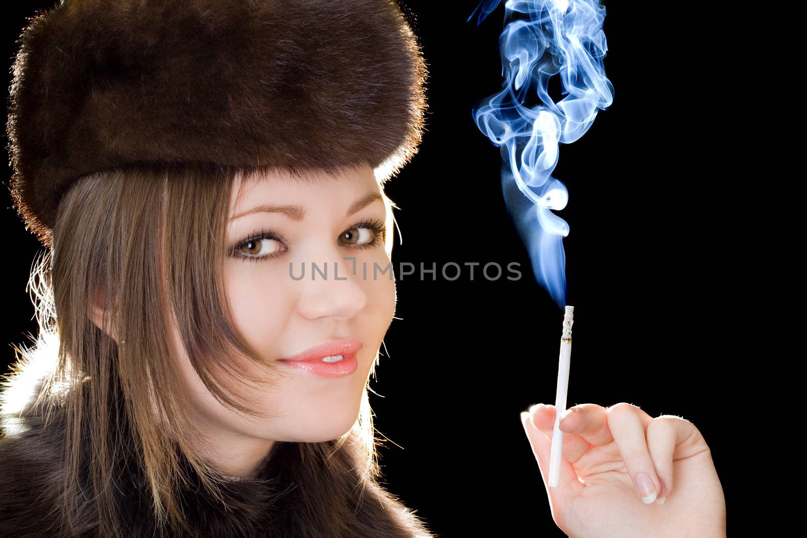 Portrait of the smiling young lady with a cigarette