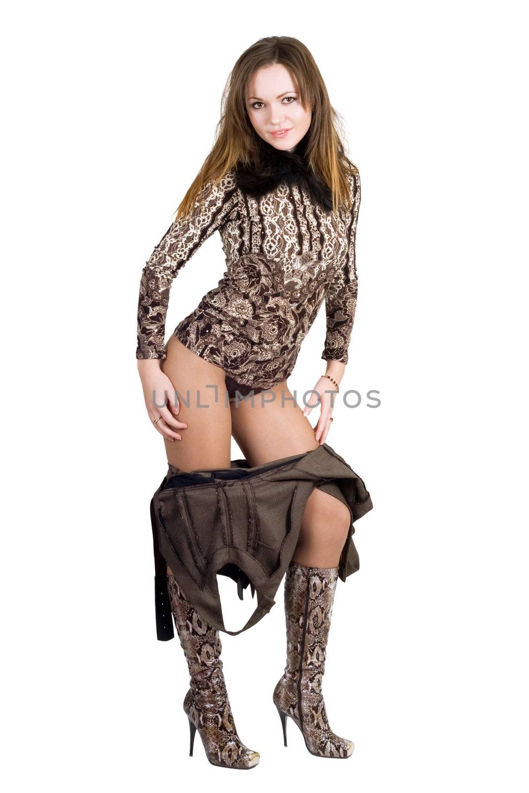 The young beautiful woman undresses. Isolated on white