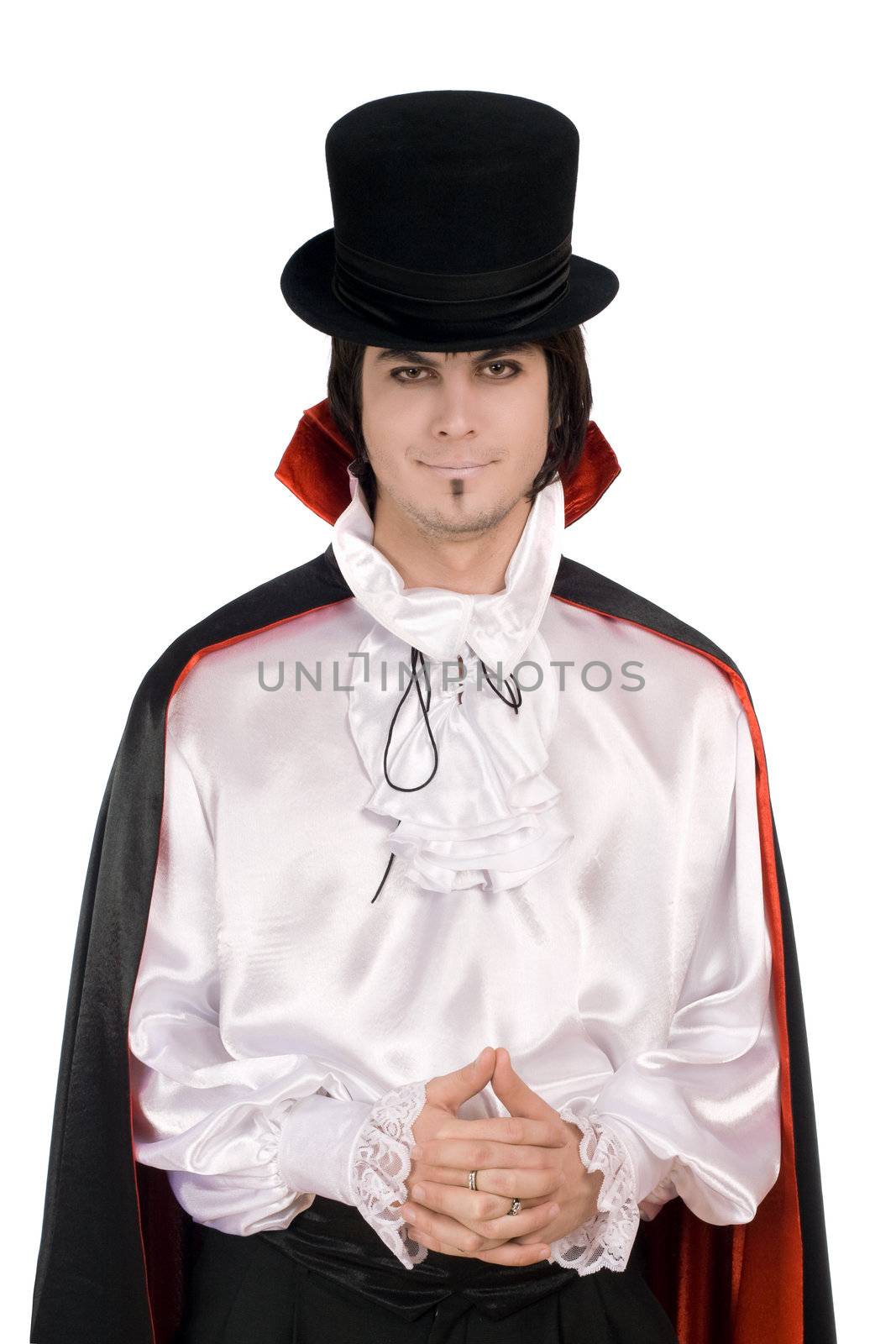 Smiling young man in a suit of Count Dracula