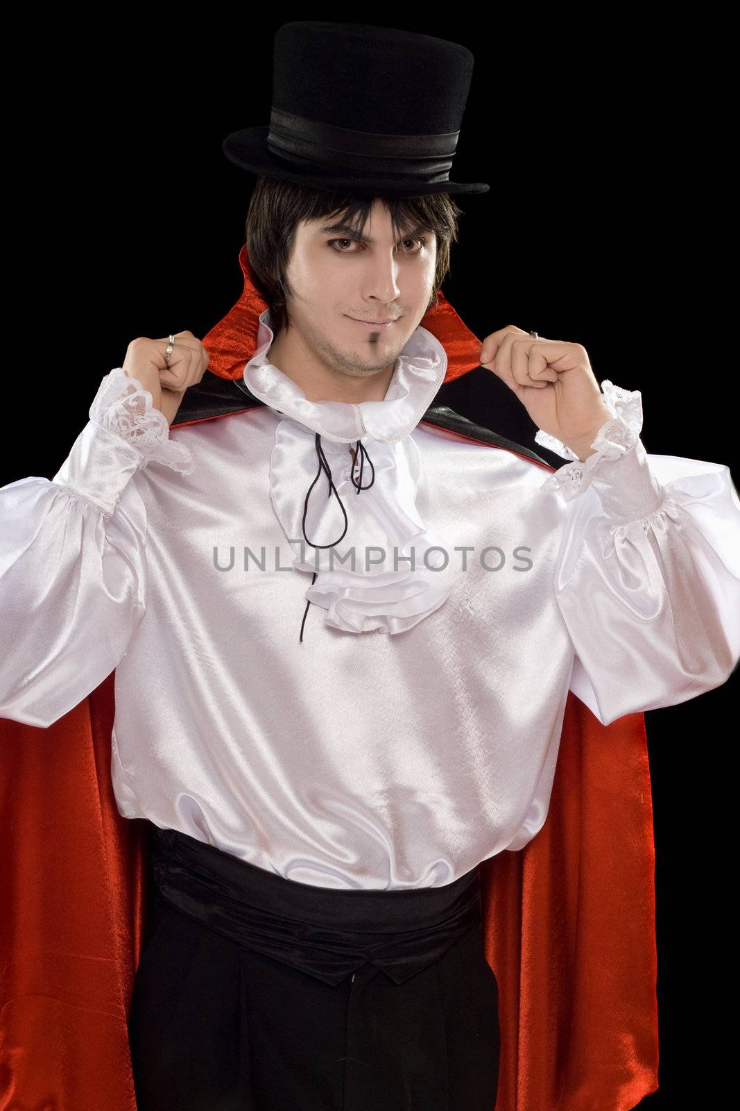 Portrait of young man in a suit of Count Dracula. Isolated