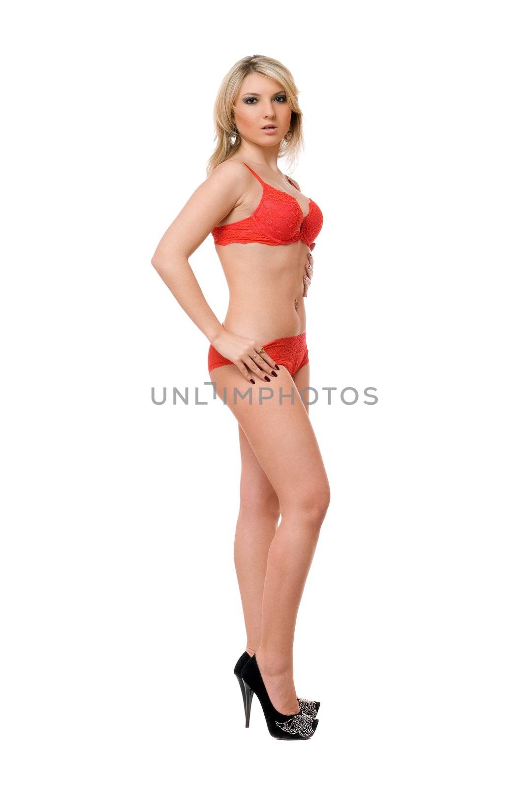 Young playful blond girl. Isolated on white