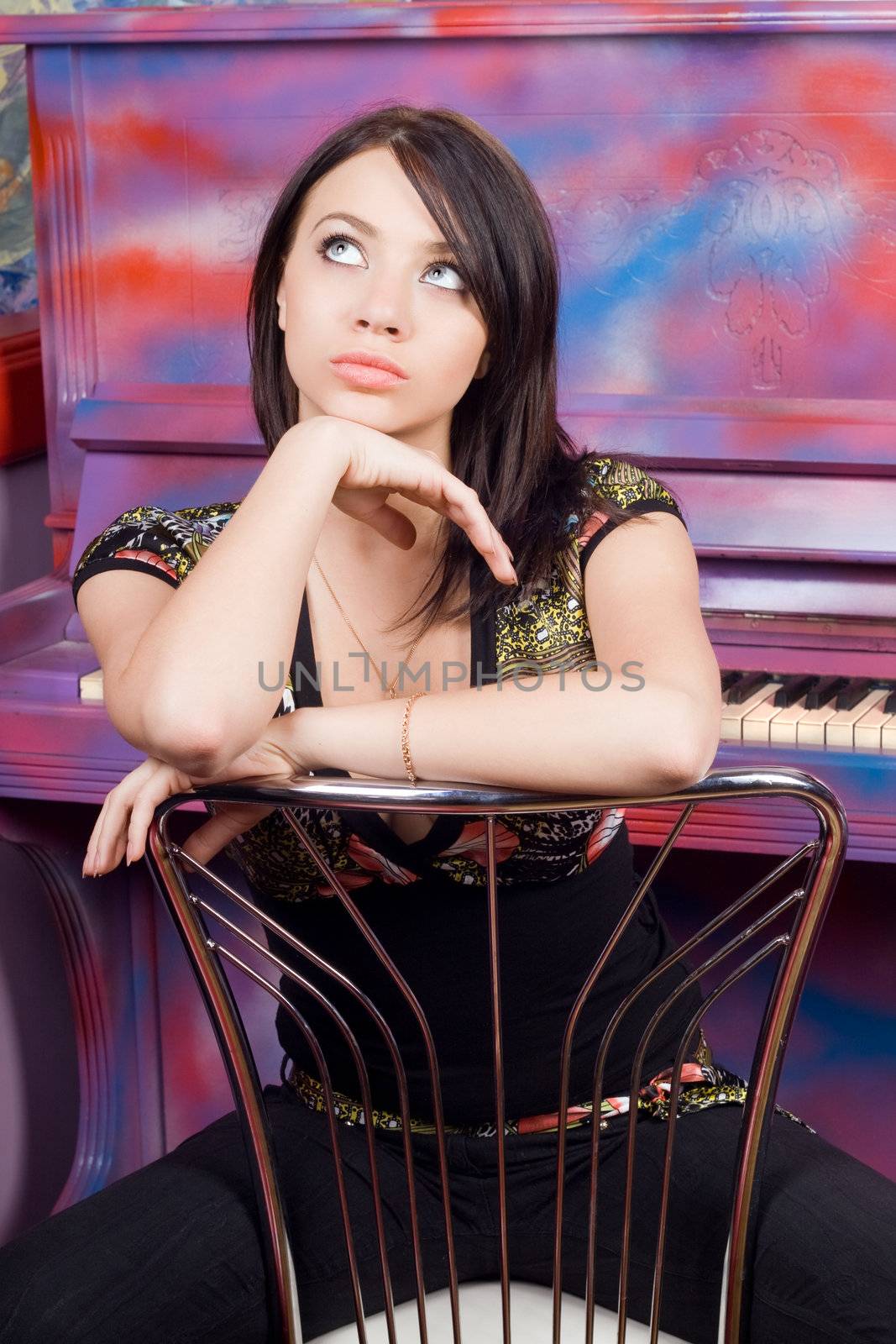 Pretty young woman sitting on a chair by acidgrey