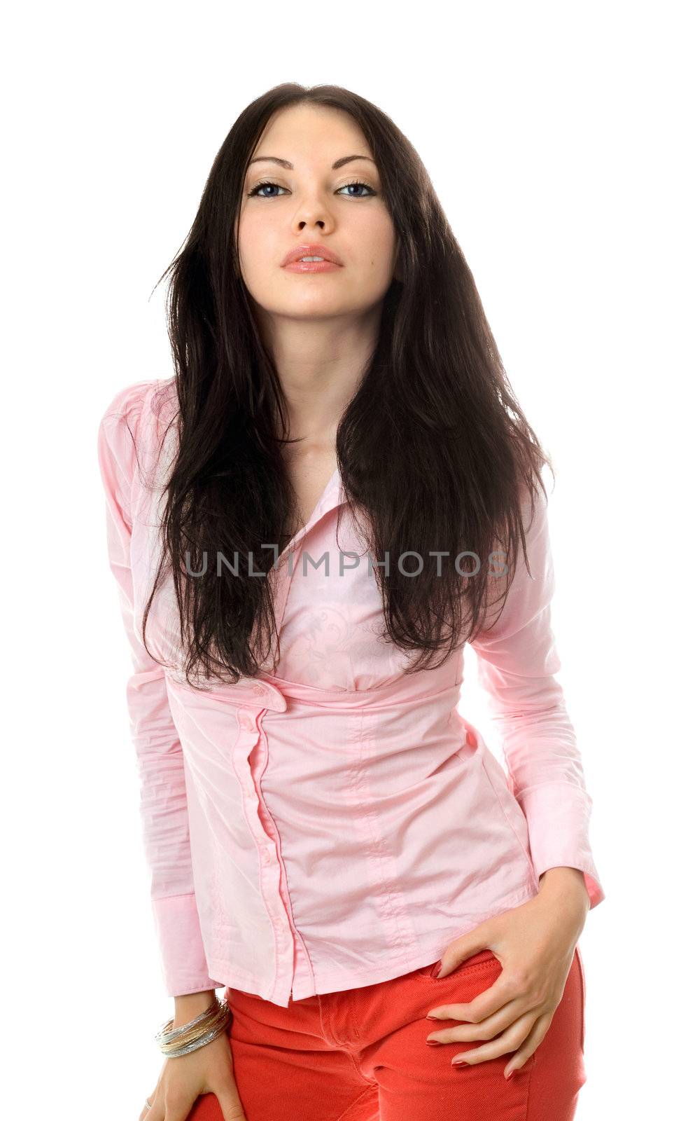 Portrait of beautiful young brunette in pink shirt