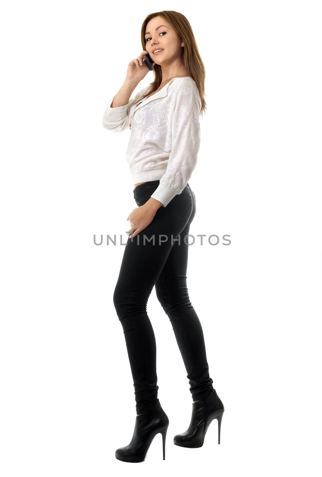 Smiling young woman talking on the phone. Isolated