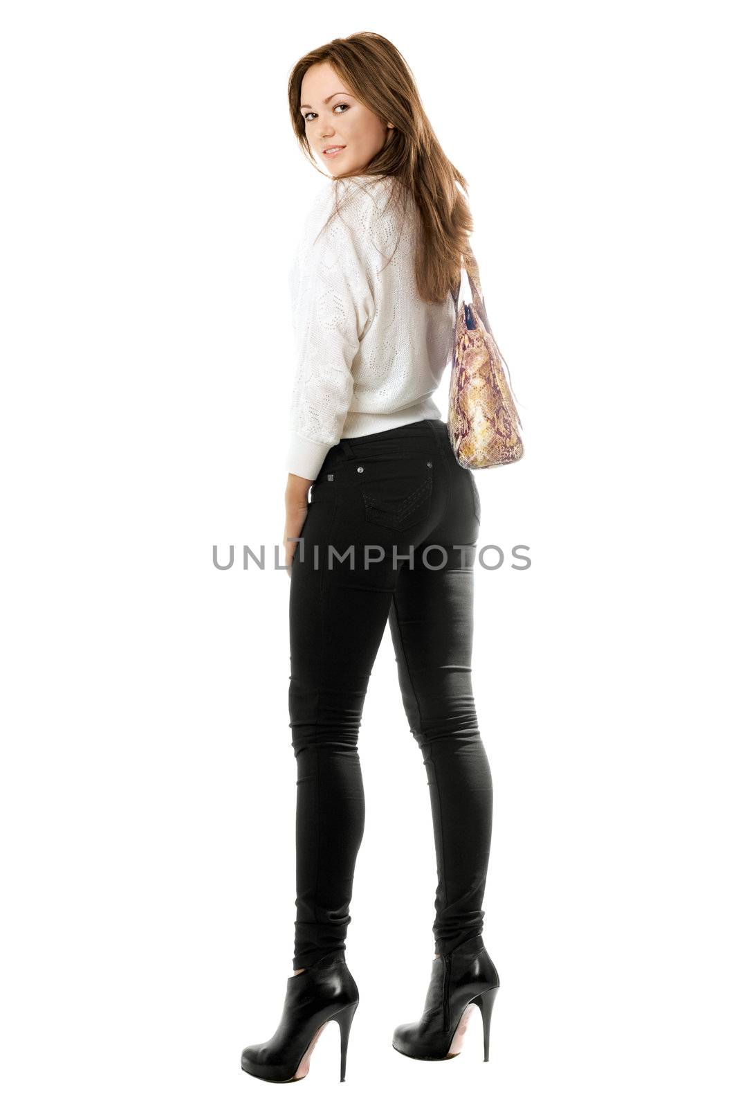 Smiling girl in black tight jeans. Isolated on white