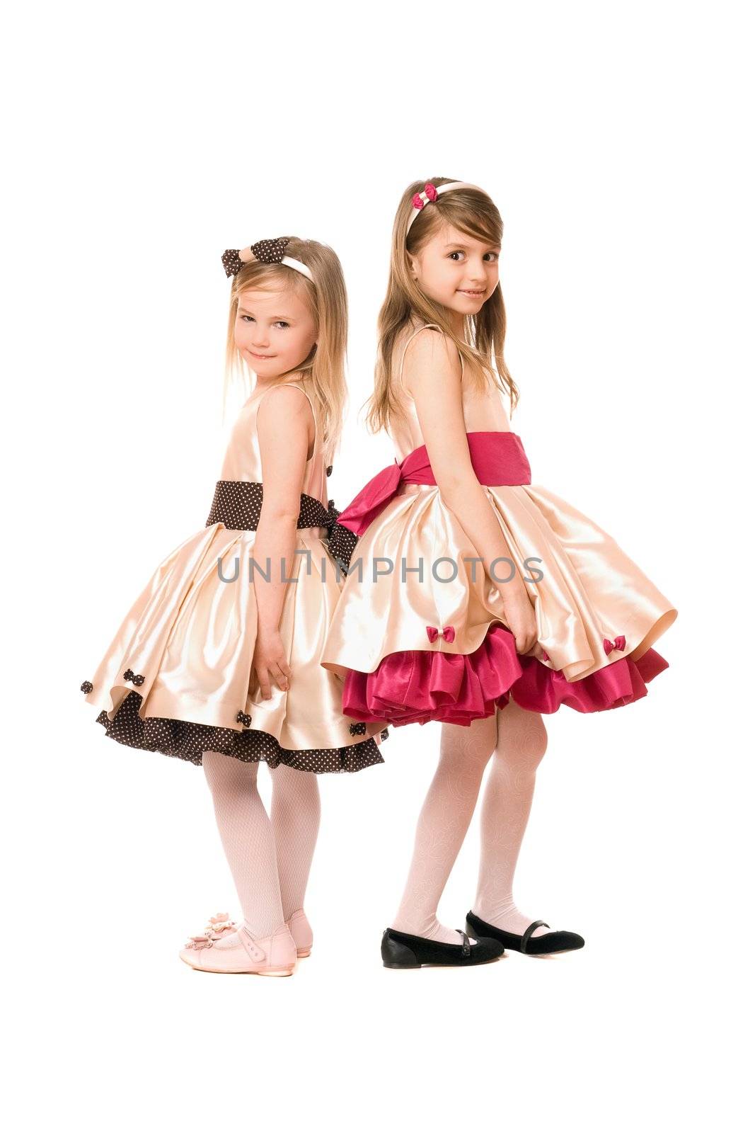 Two nice little girls in a dress. Isolated