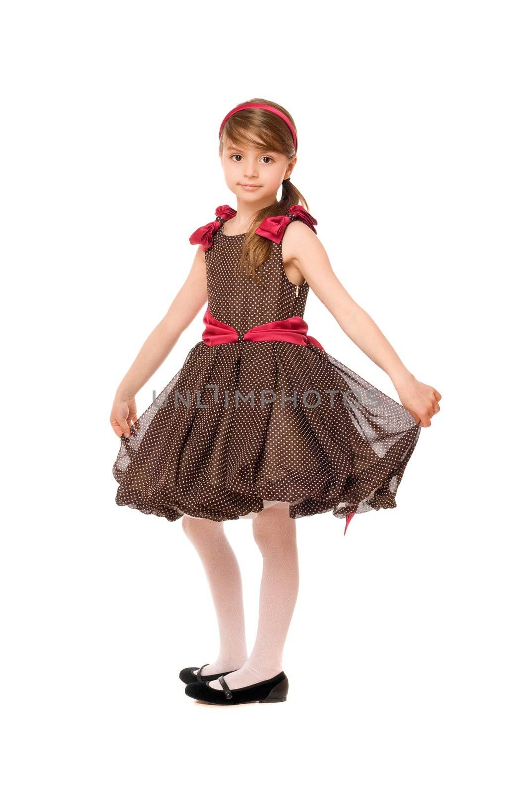 Lovely little lady in a brown dress. Isolated
