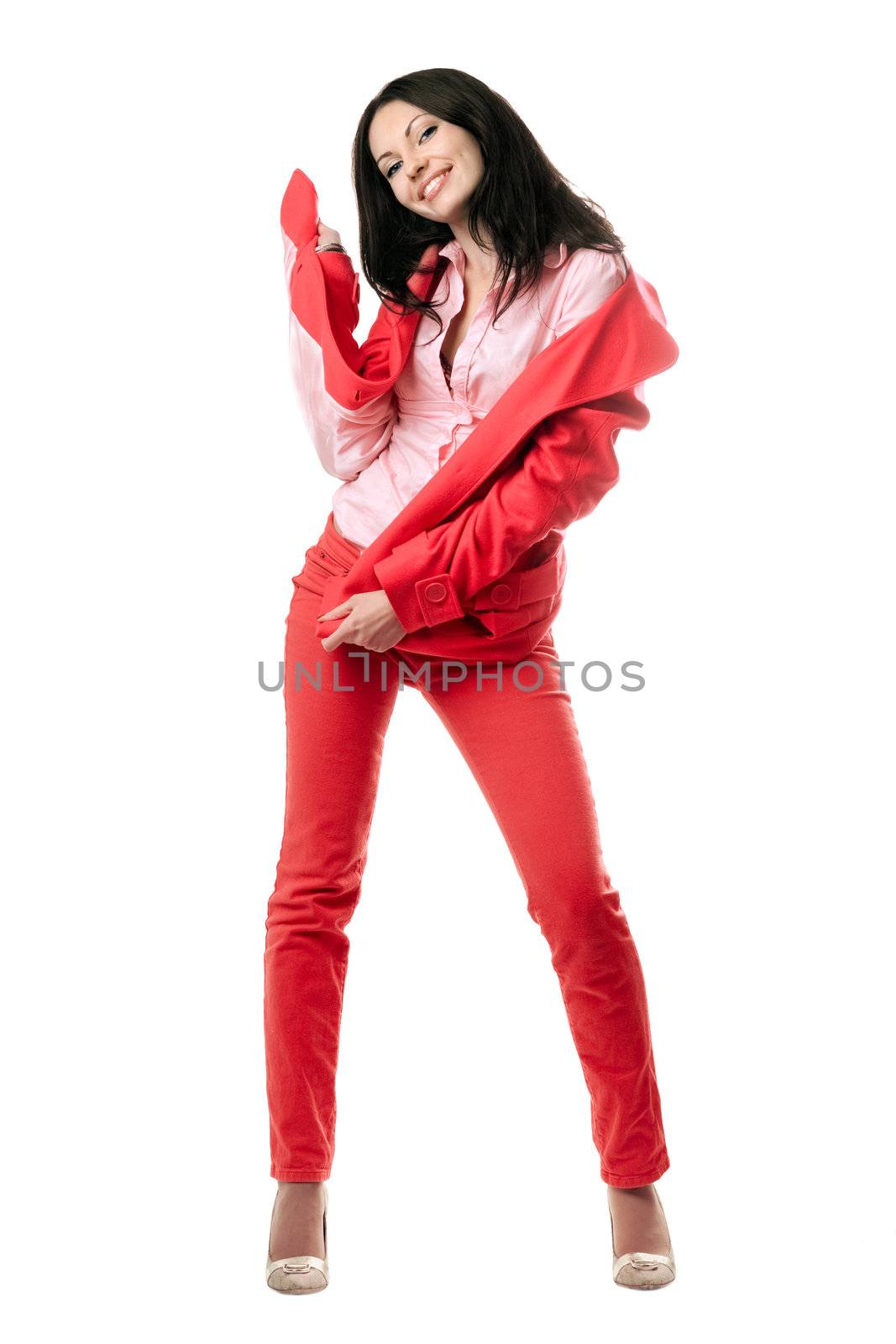 Happy young brunette in red suit. Isolated on white