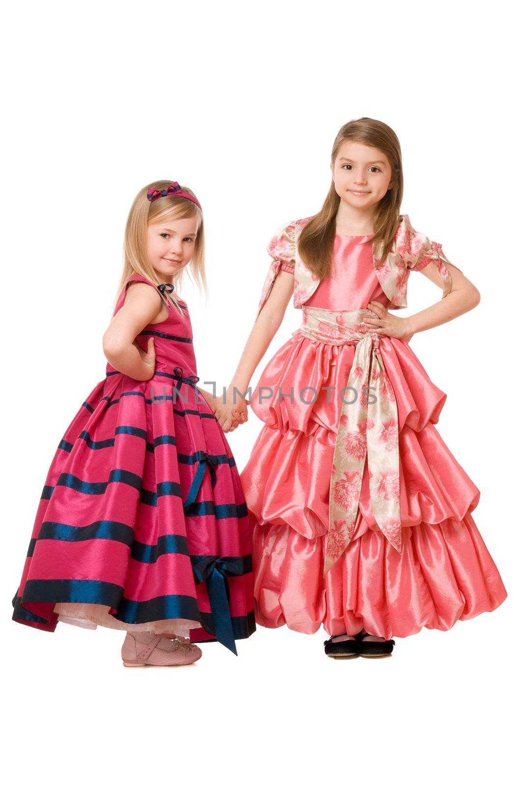 Two cute little girls in a long dress