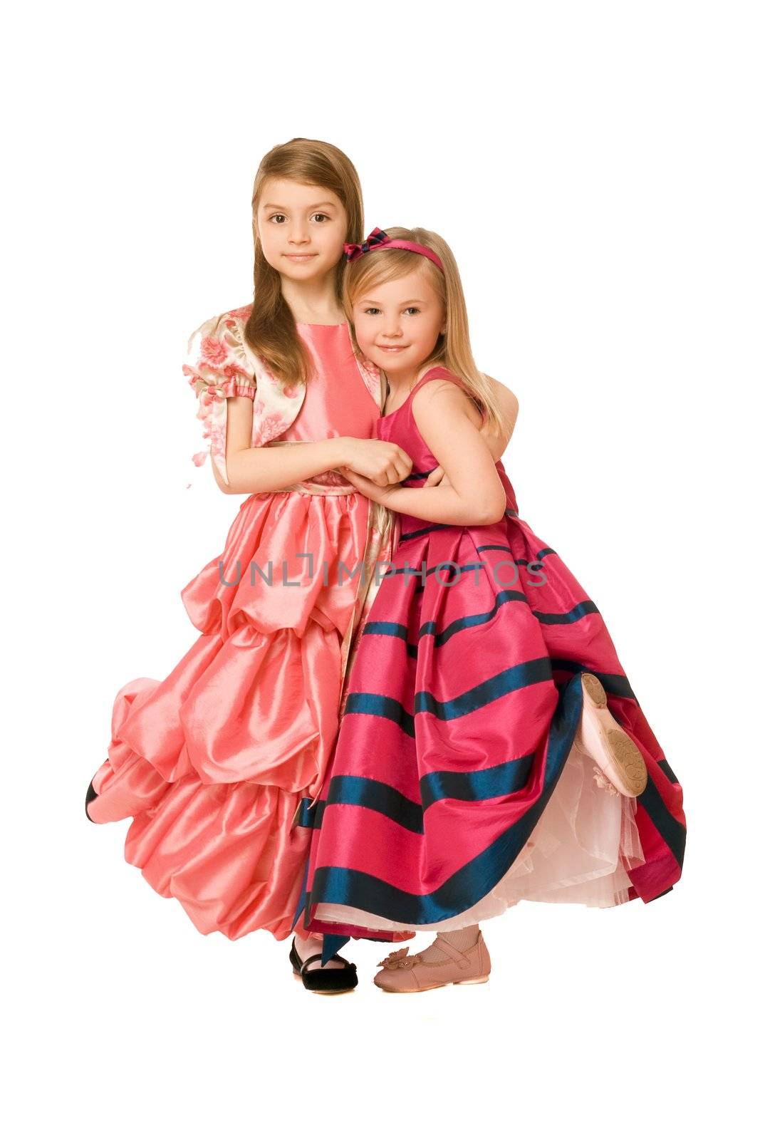 Two attractive little girls in a long dress