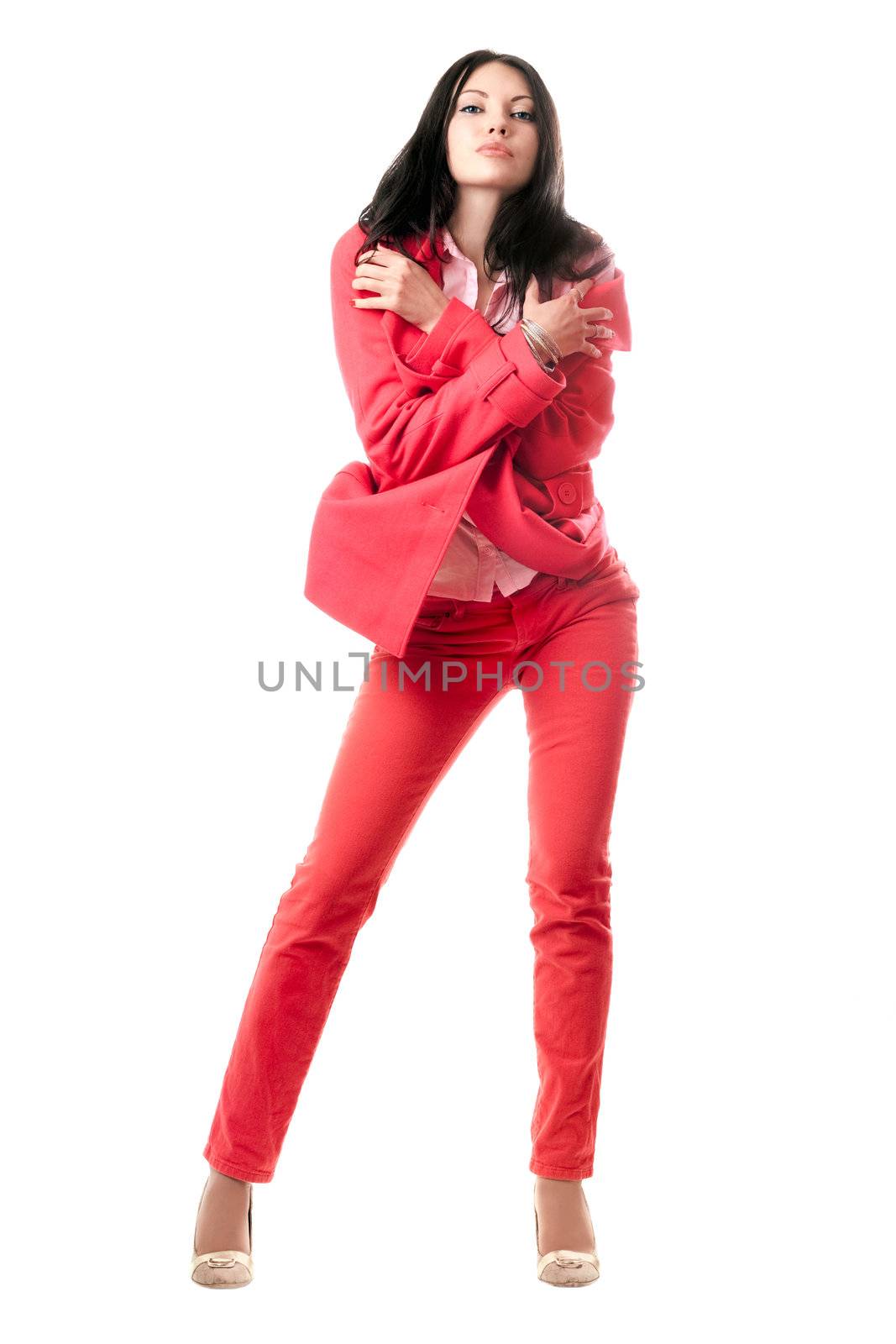 Sexy young brunette in red suit. Isolated by acidgrey