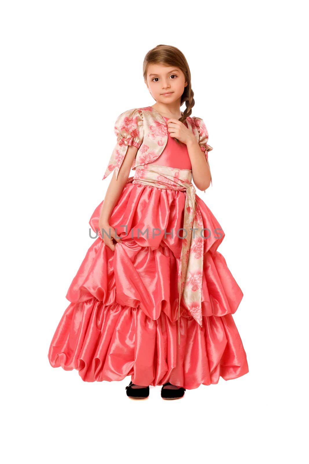 Charming little girl in a long dress. Isolated