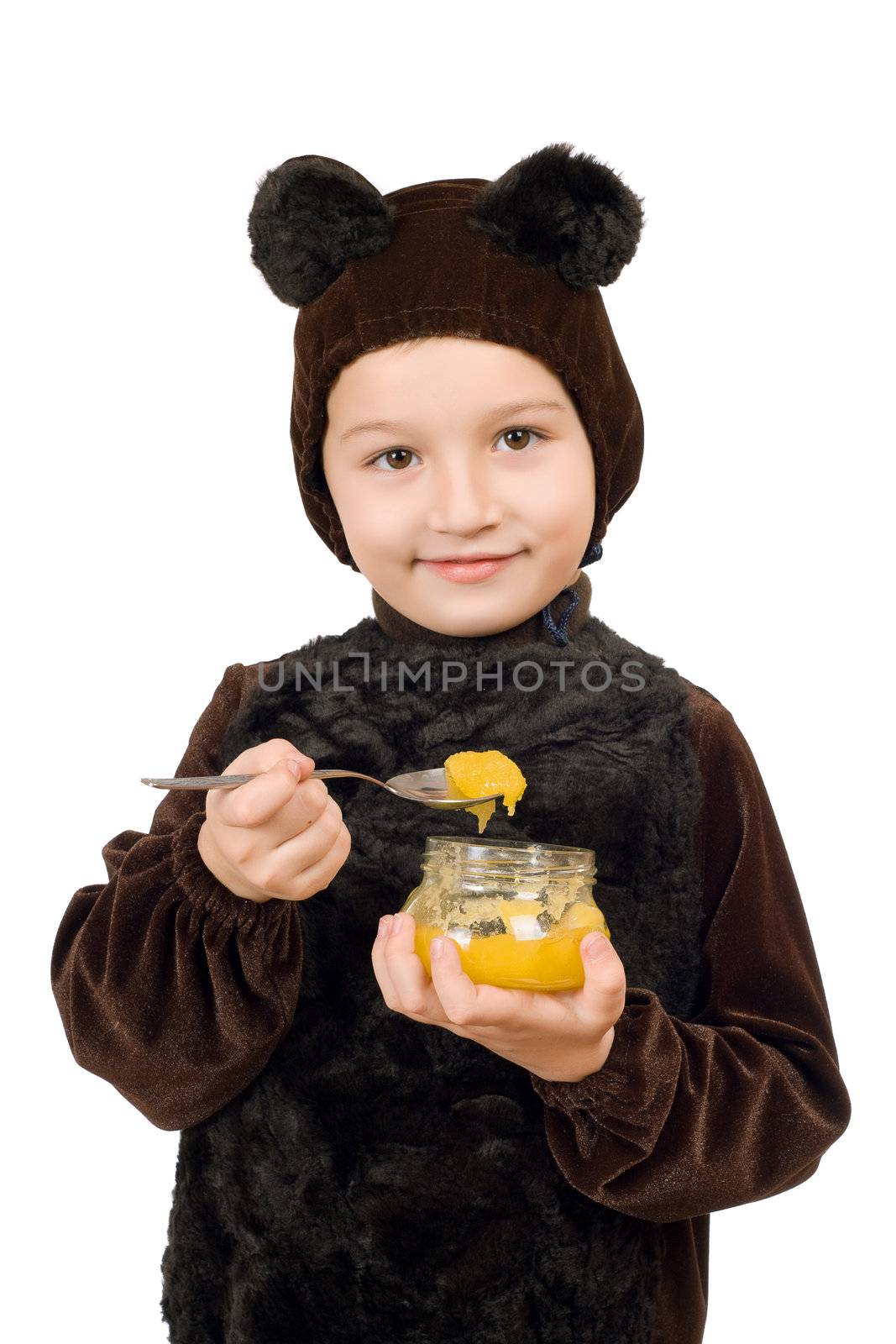 Boy dressed as bear with a jar of honey. Isolated