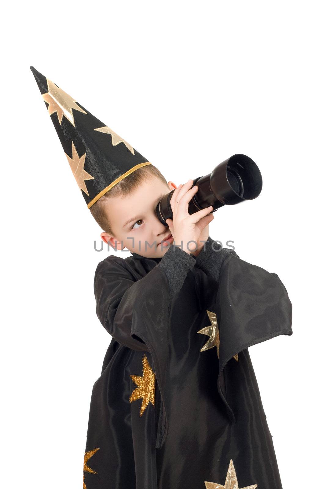 Boy dressed as astrologer looking through a telescope. Isolated