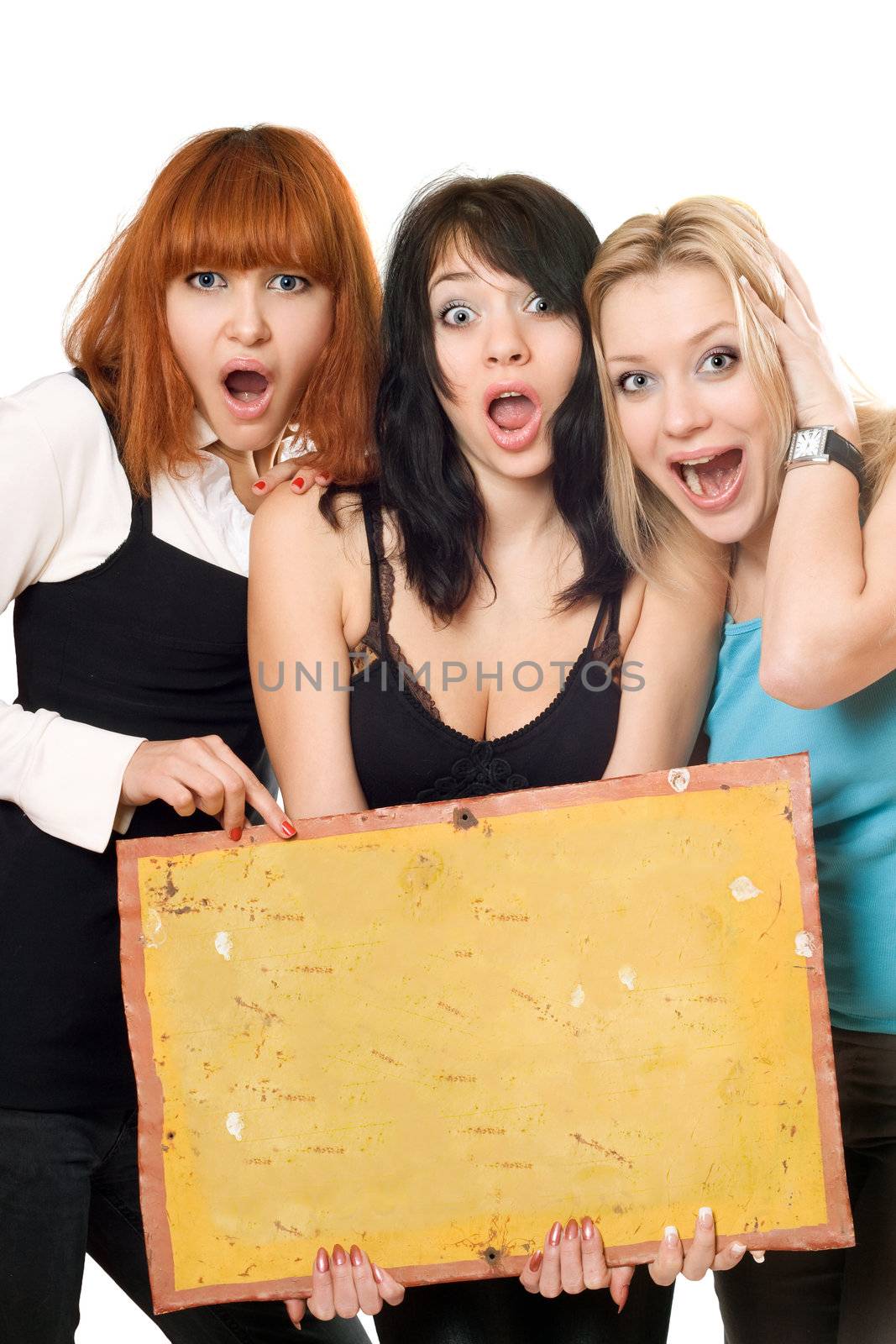 Three young excited women holding vintage yellow board