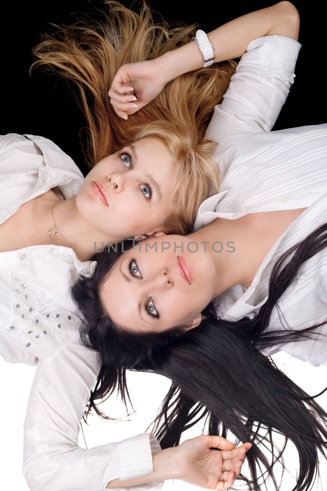 Portrait of the two attractive blonde and brunette