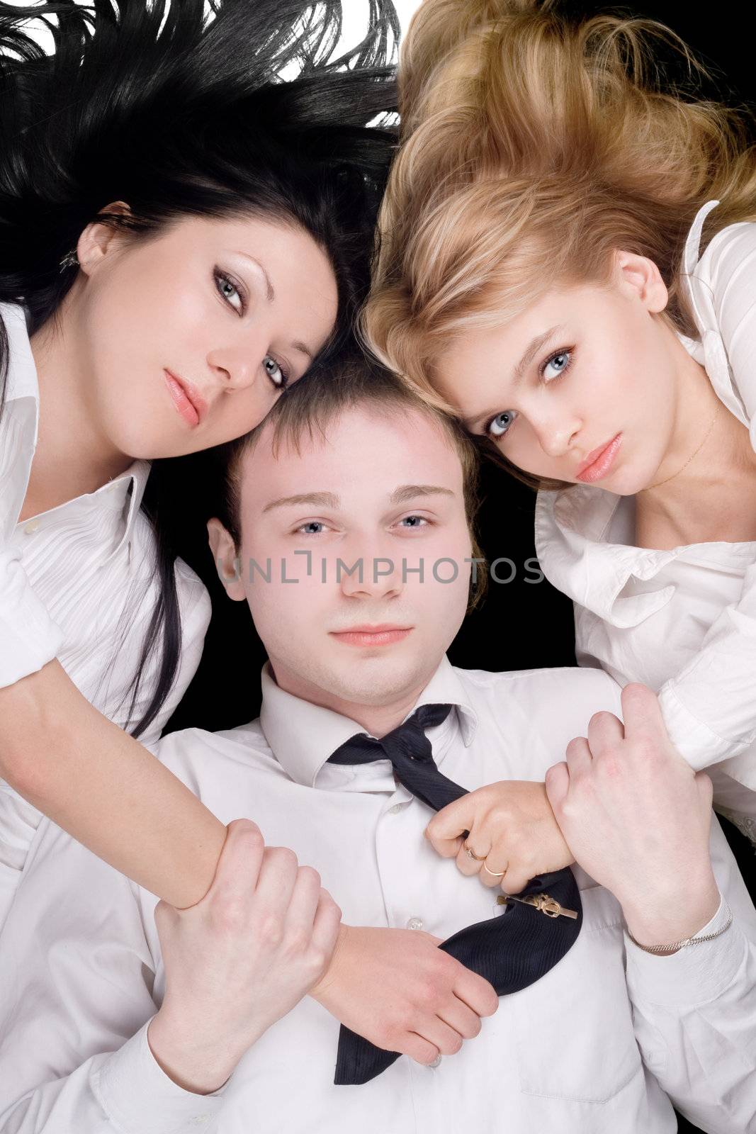 Portrait if the young man and two pretty girls