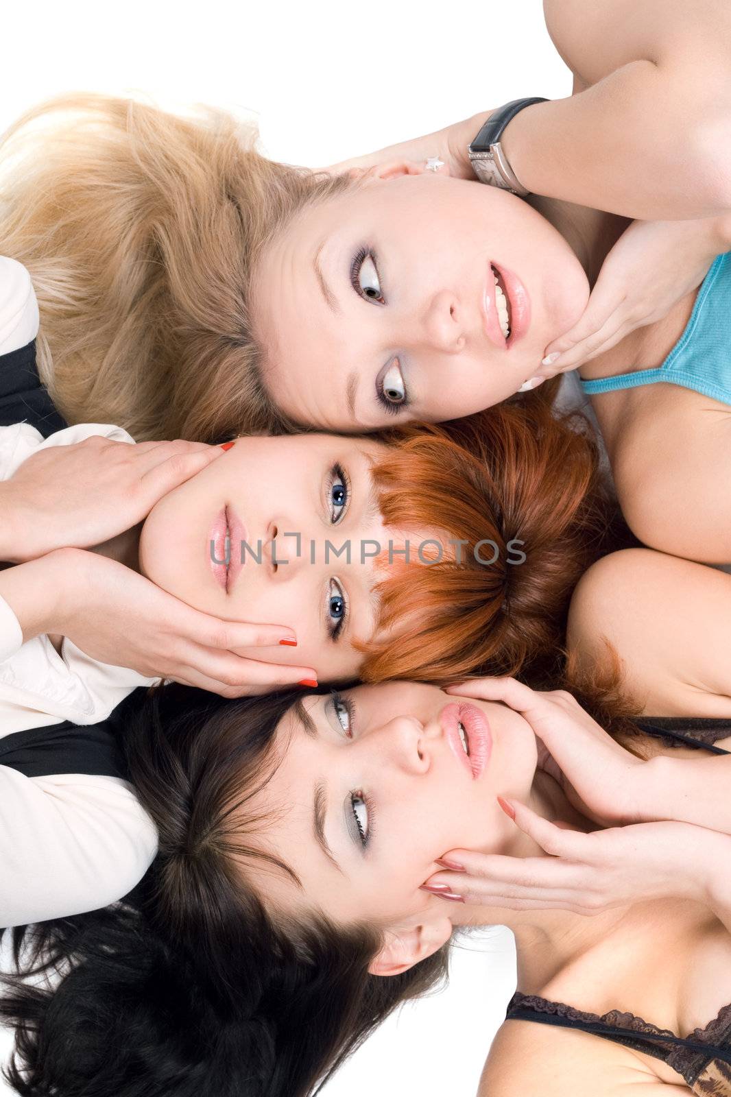 Close-up of three disturbed women touching their cheeks on white background