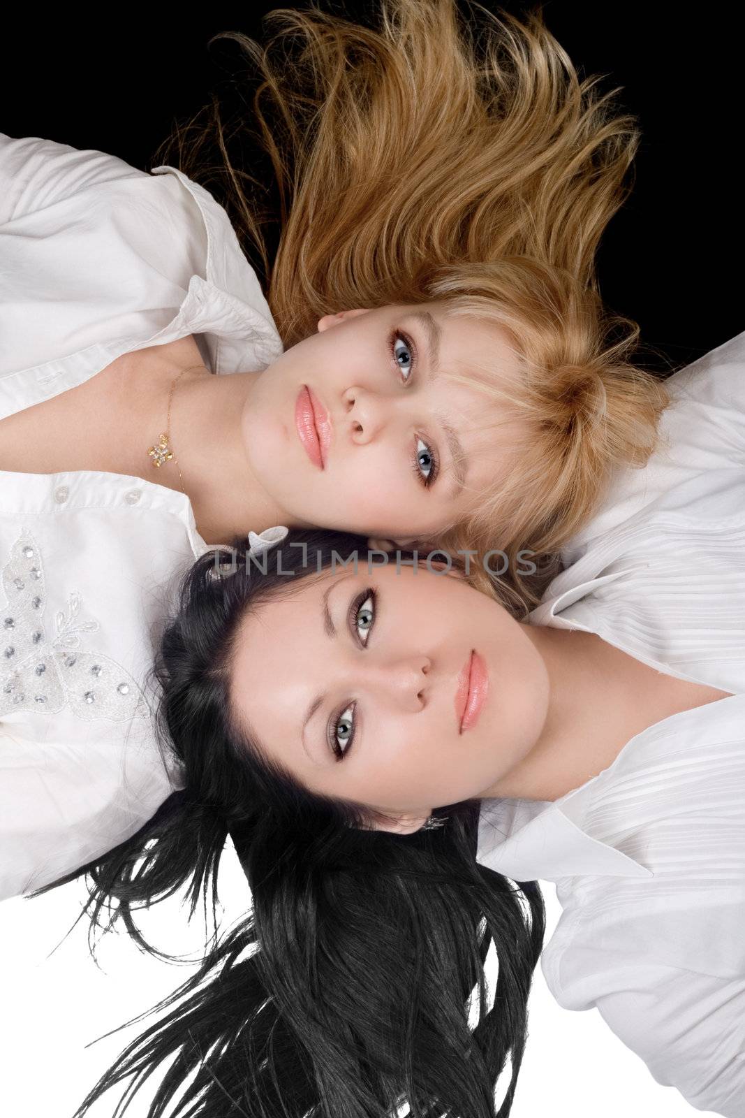 Portrait of the two lovely blonde and brunette