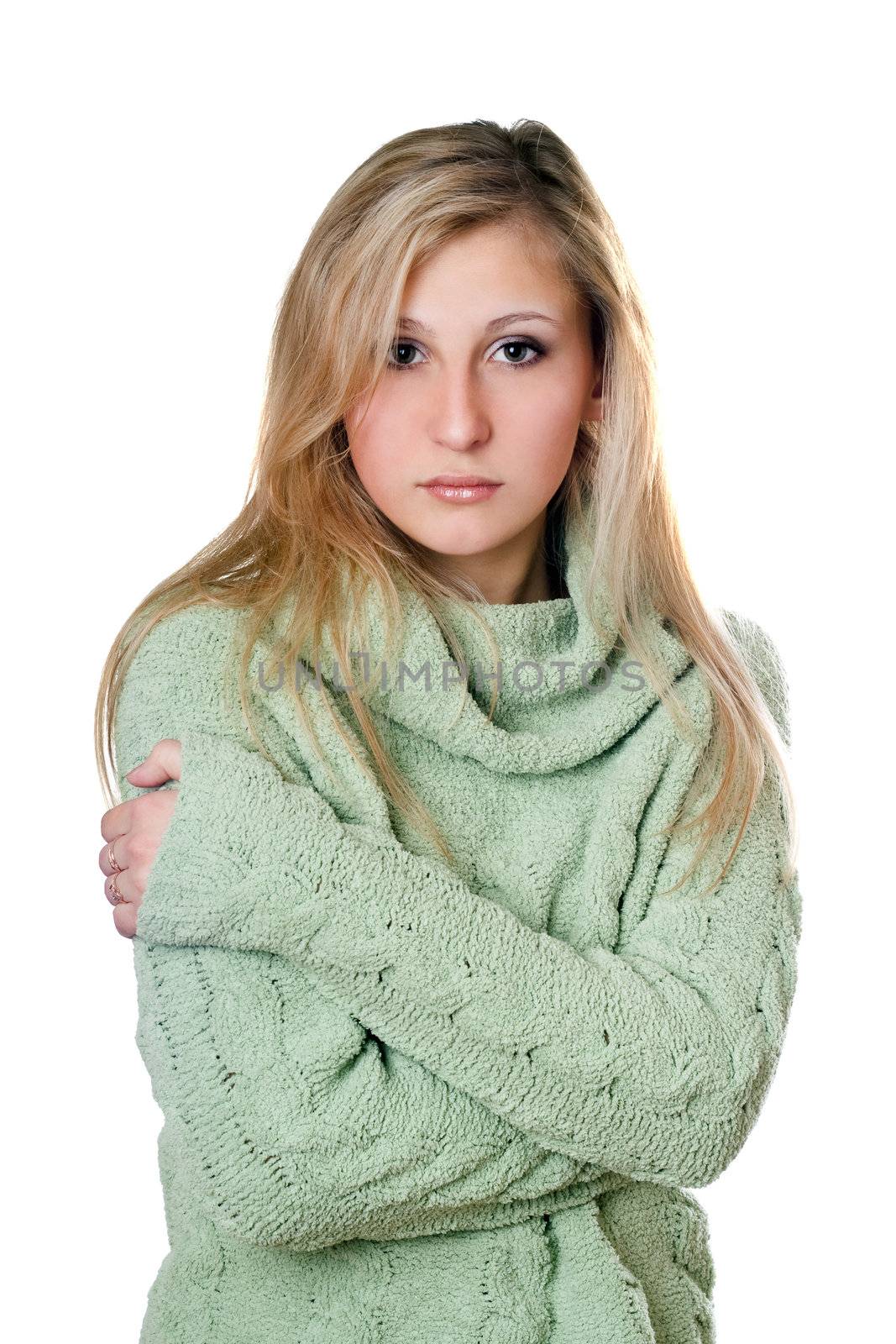 Young beautiful woman in warm sweater. Isolated on white