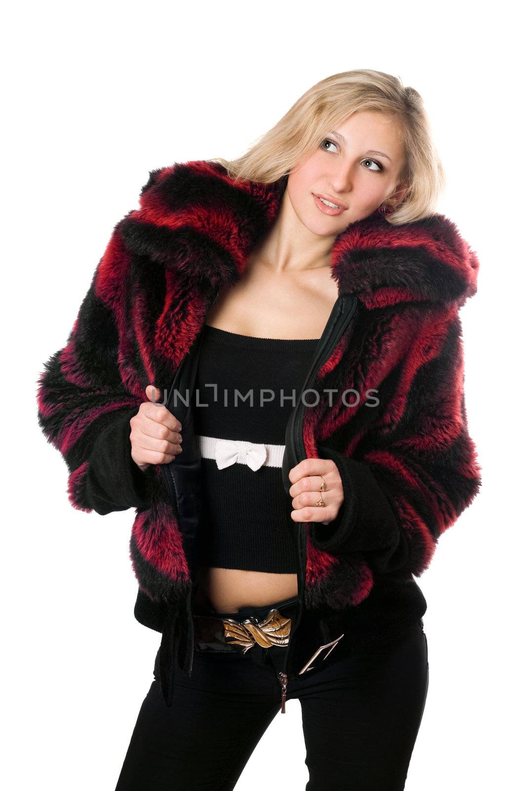 Young sexy blond woman in a fur jacket. Isolated on white