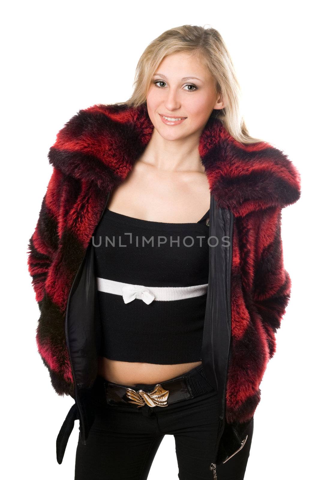 Smiling young blond woman in a fur jacket. Isolated on white