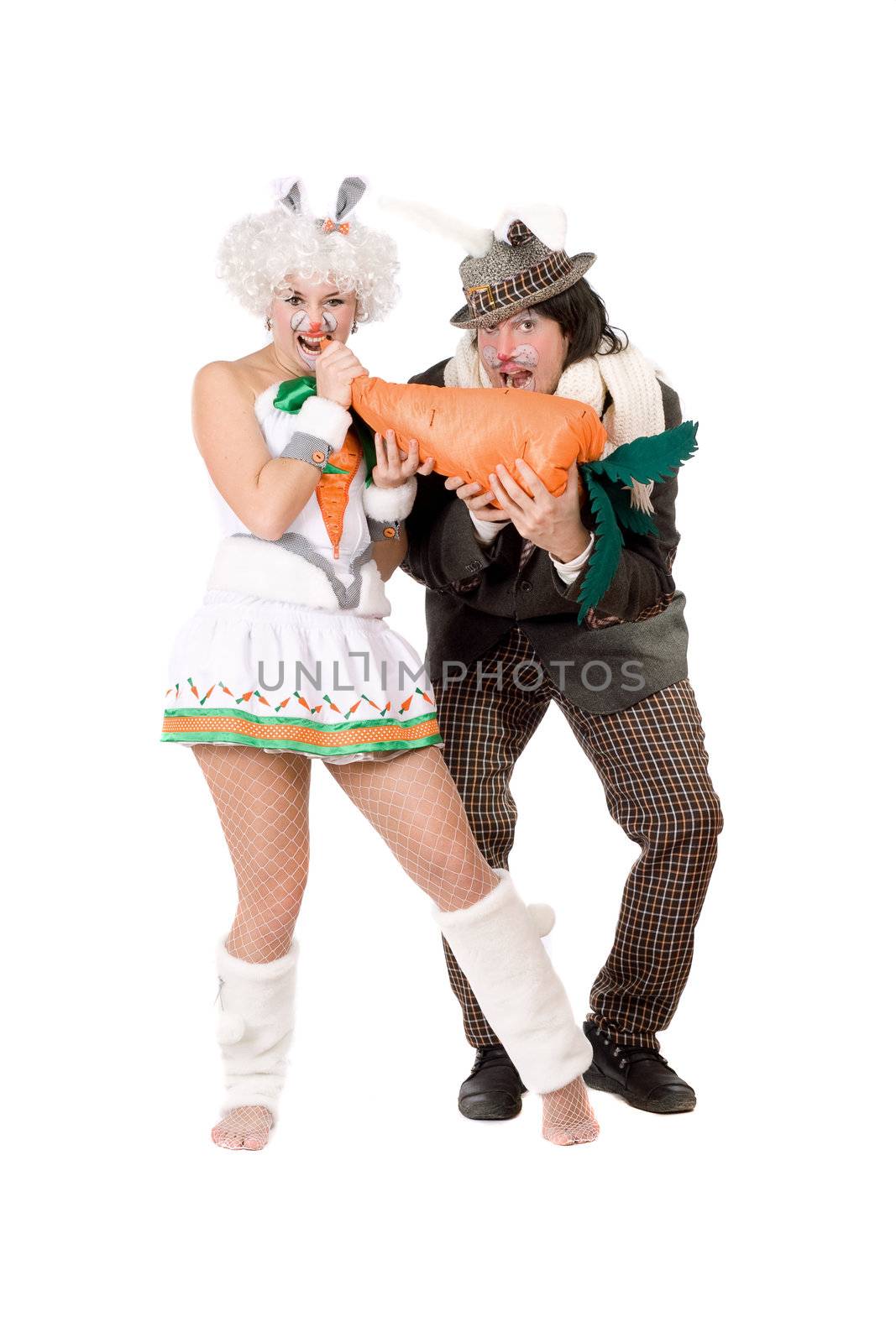 Funny couple with carrot dressed as rabbits. Isolated