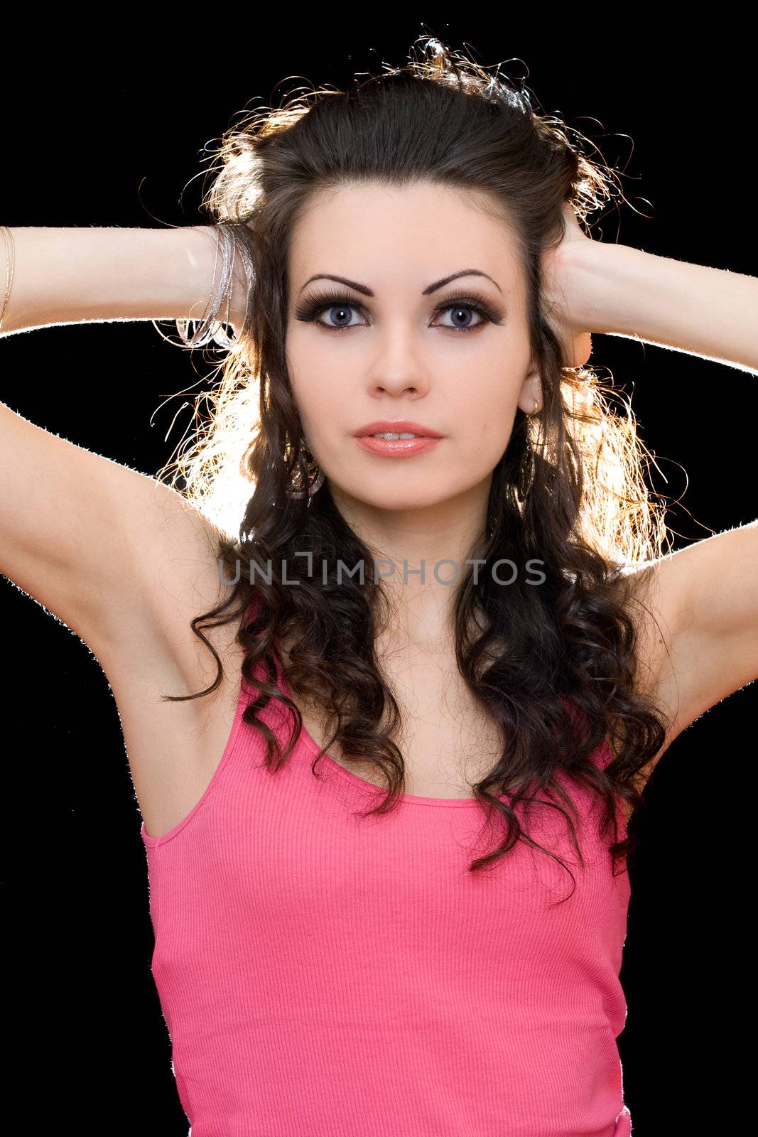 Portrait of attractive young brunette in a pink t-shirt