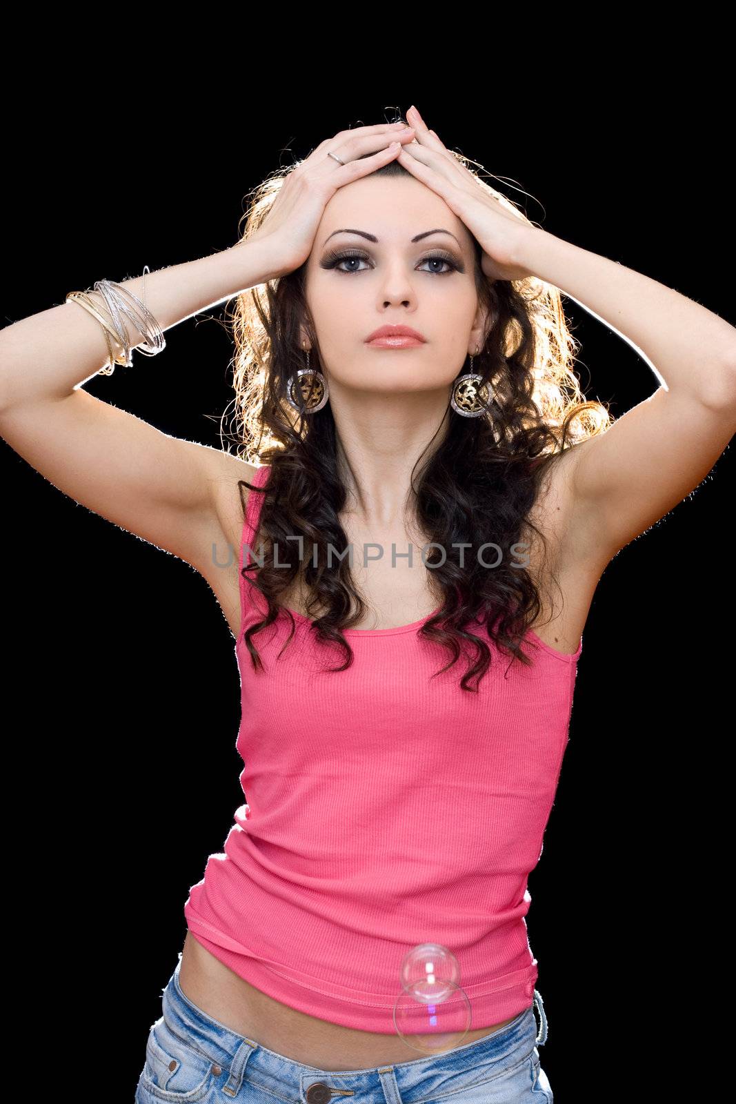 Portrait of passionate young brunette in a pink t-shirt