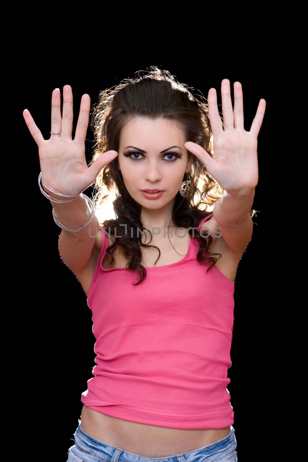 Portrait of sensual young brunette in a pink t-shirt