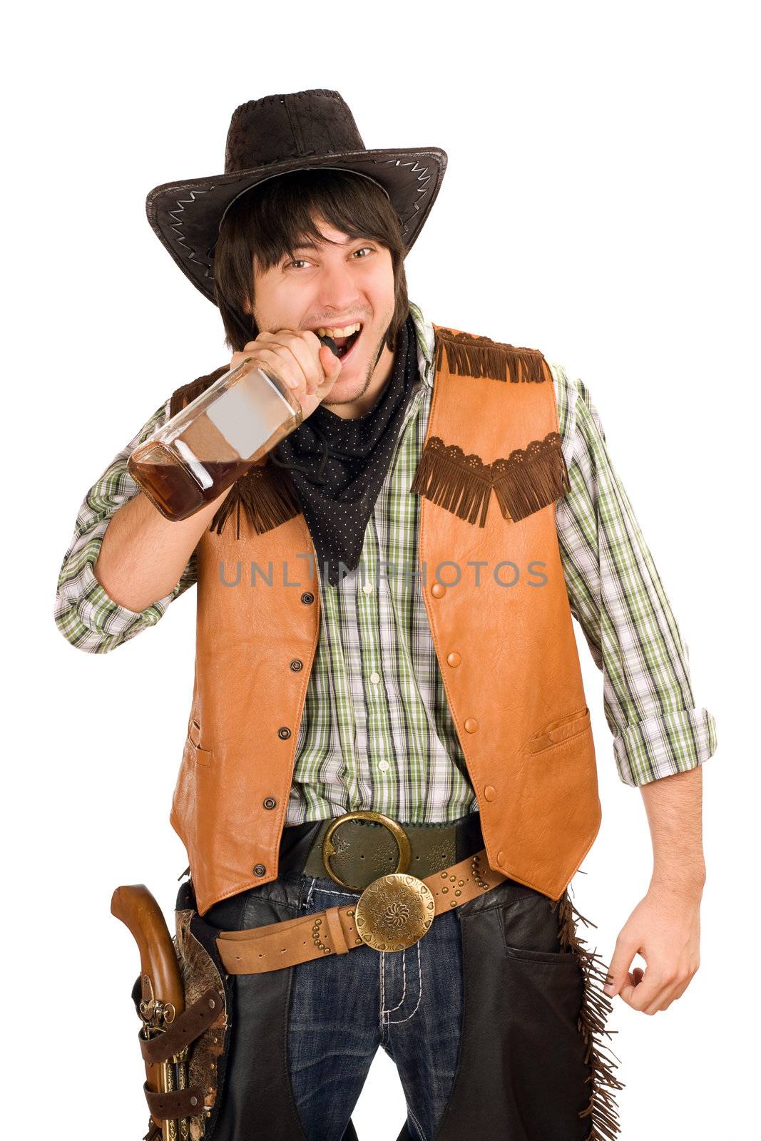 Portrait of young cowboy with a bottle of whiskey