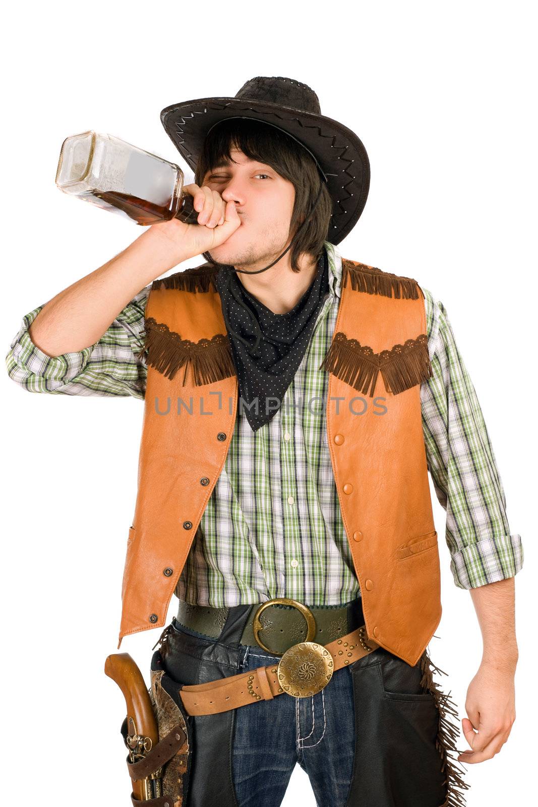 Cowboy drinking whiskey from the bottle. Isolated