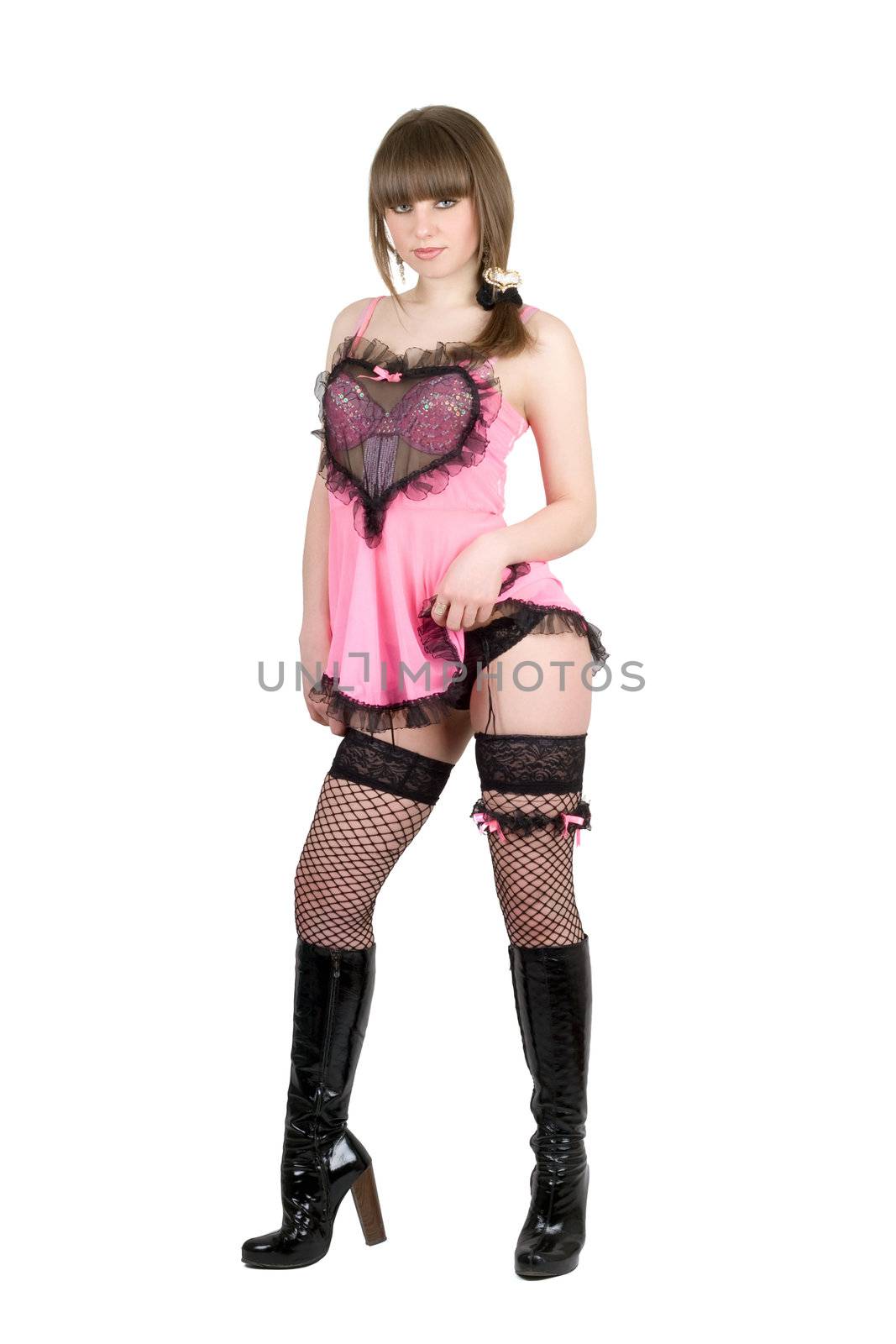 Playful girl in a pink dress and black boots