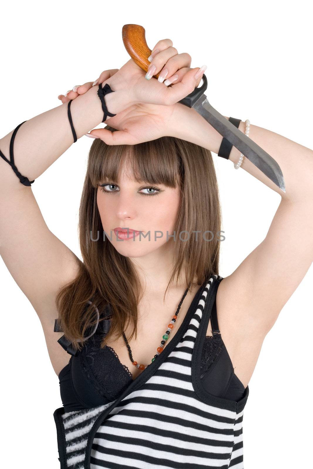 Pretty girl in a striped dress with a knife