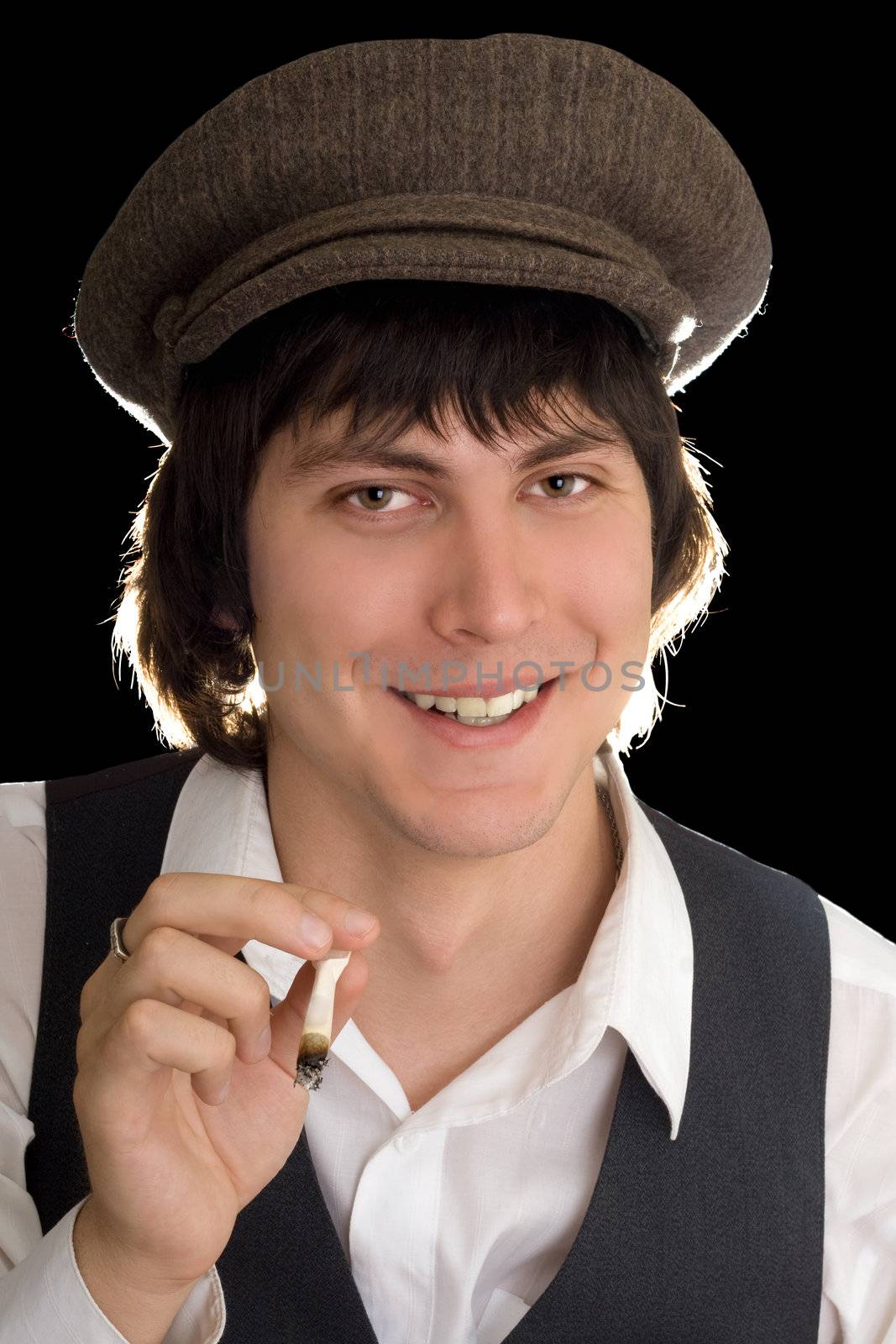 Portrait of a joyous man with a cigarette. Isolated on black