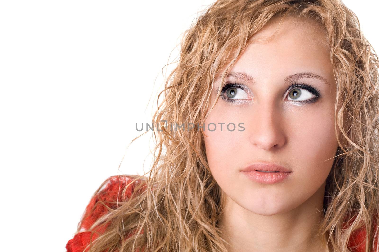 Portrait of pretty thoughtful young blonde. Isolated on white