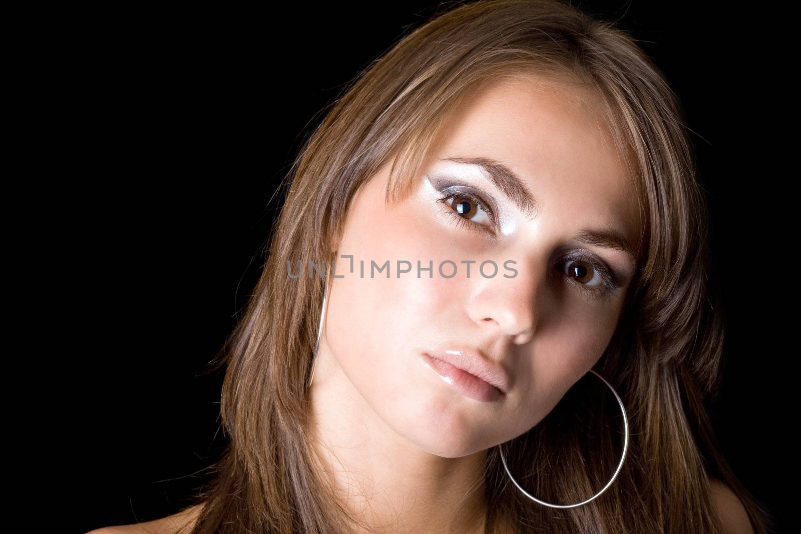 Portrait of the young woman. Isolated on black background