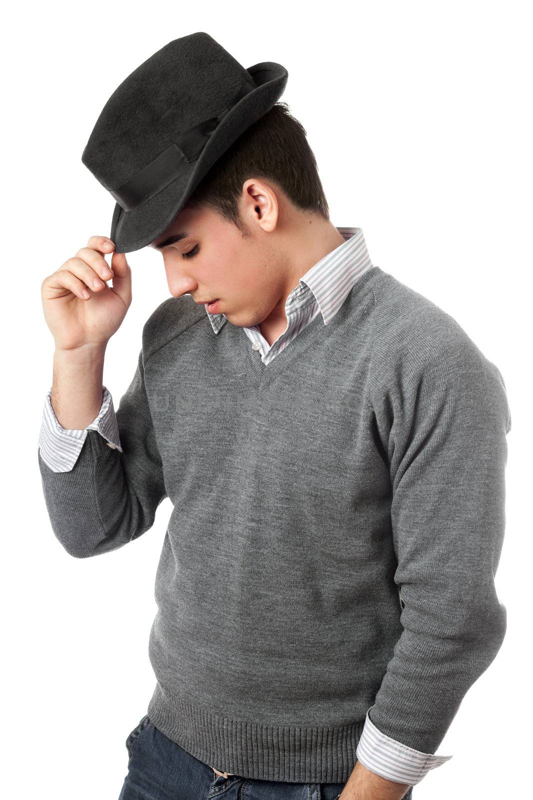 Handsome young man wearing black hat. Isolated on white