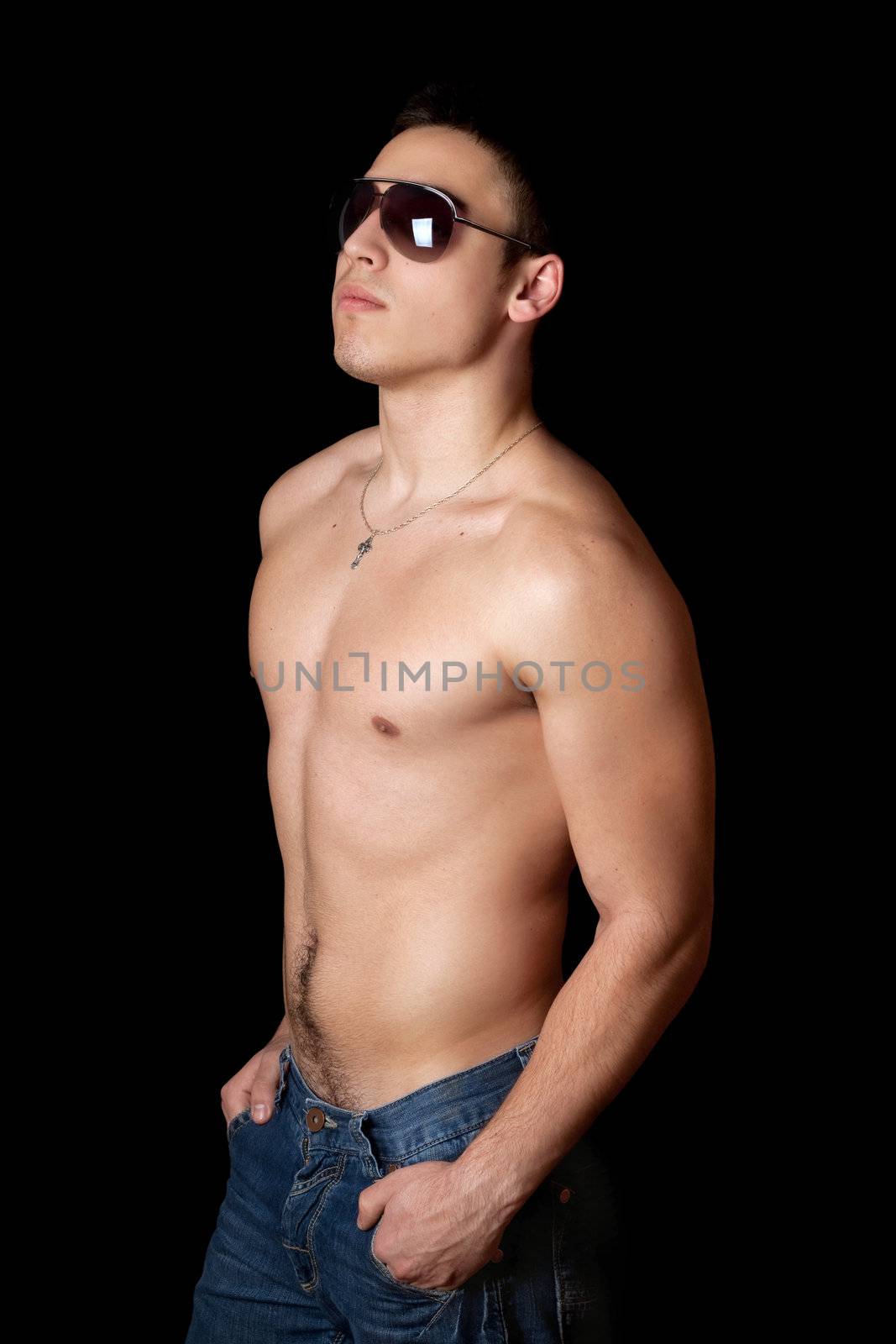 Portrait of young man. Isolated on black