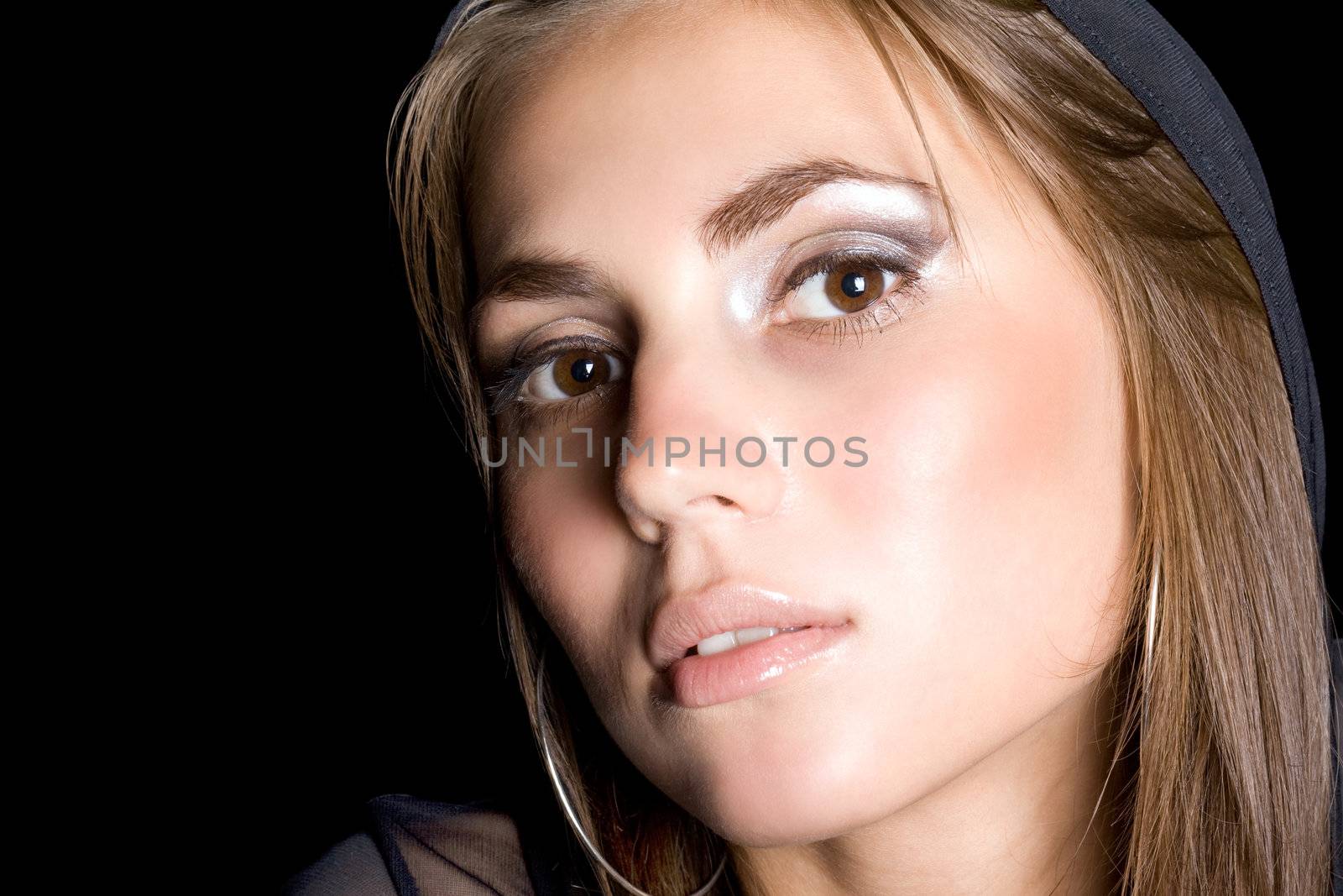 portrait of the pretty young woman. Isolated on black