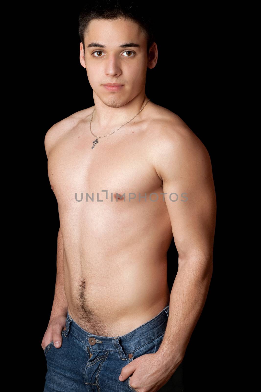Portrait of young handsome man. Isolated on black